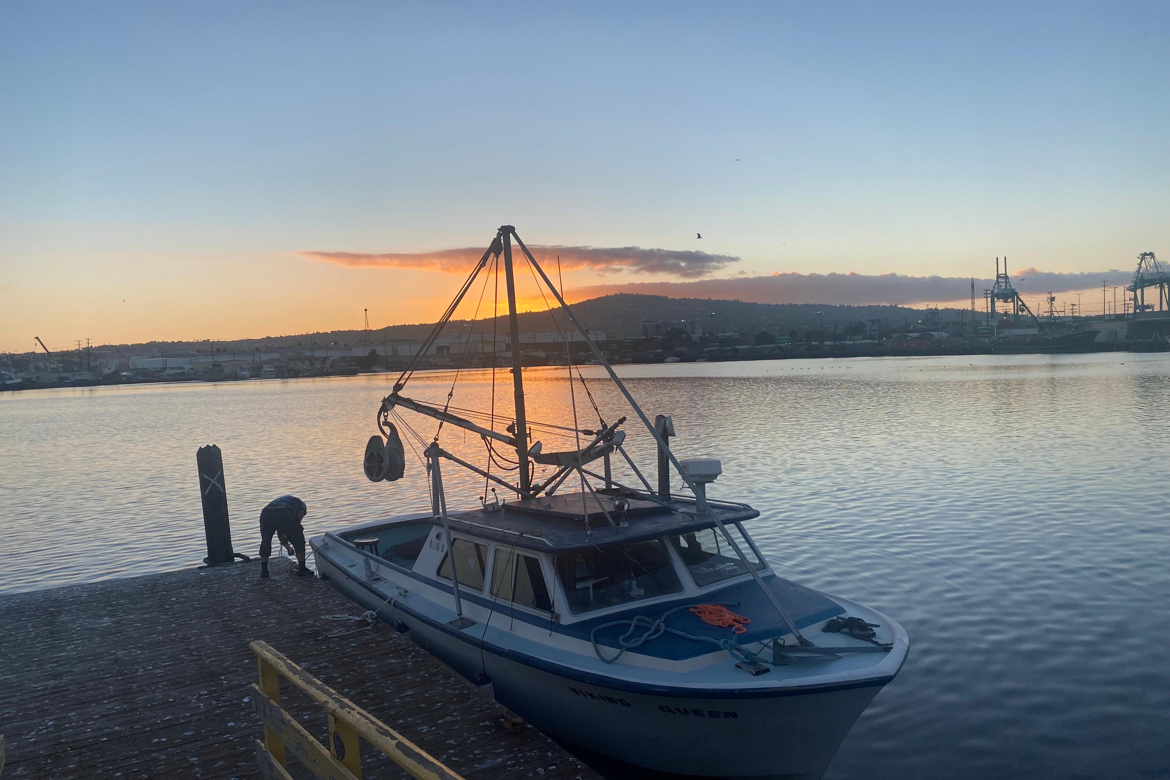 Boat docked at sunset, Roberts 30 model, 1977, serene waterfront view.