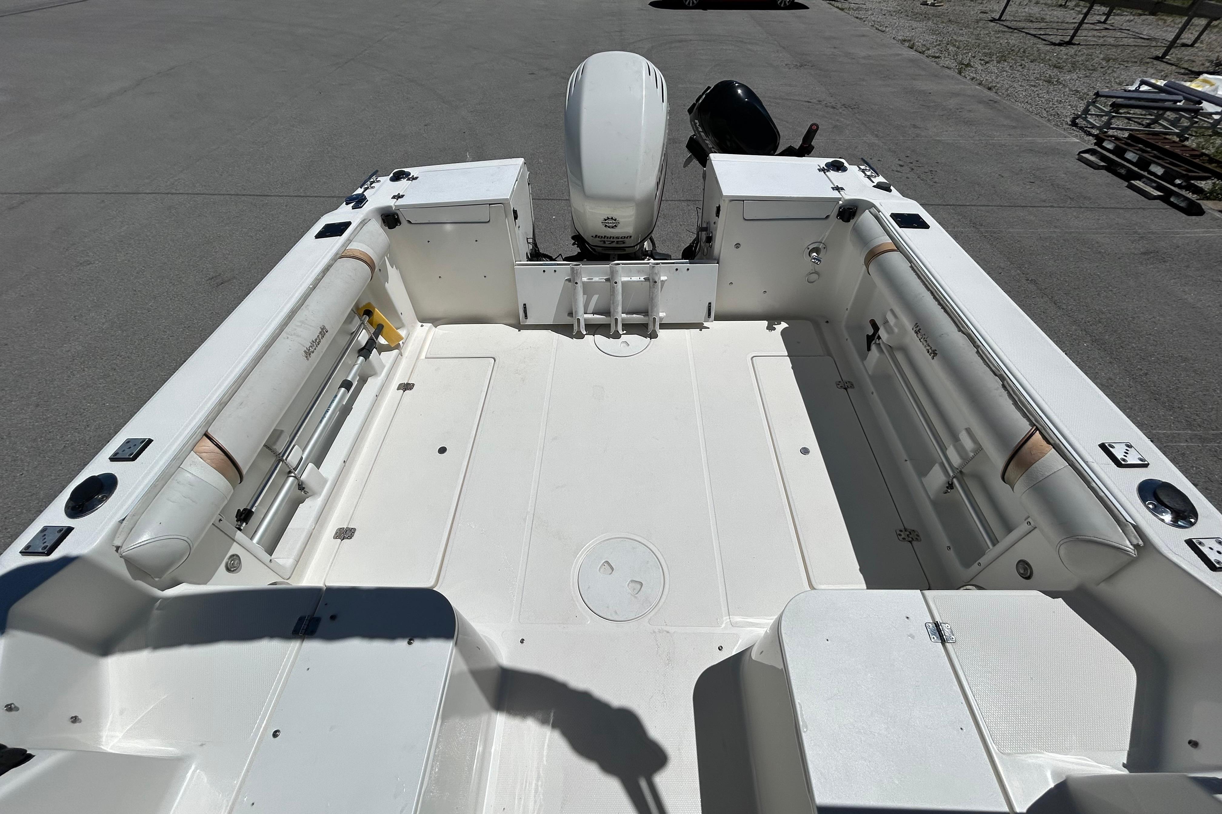 2003 Wellcraft 220 Coastal boat interior with seating and motor, viewed from above.