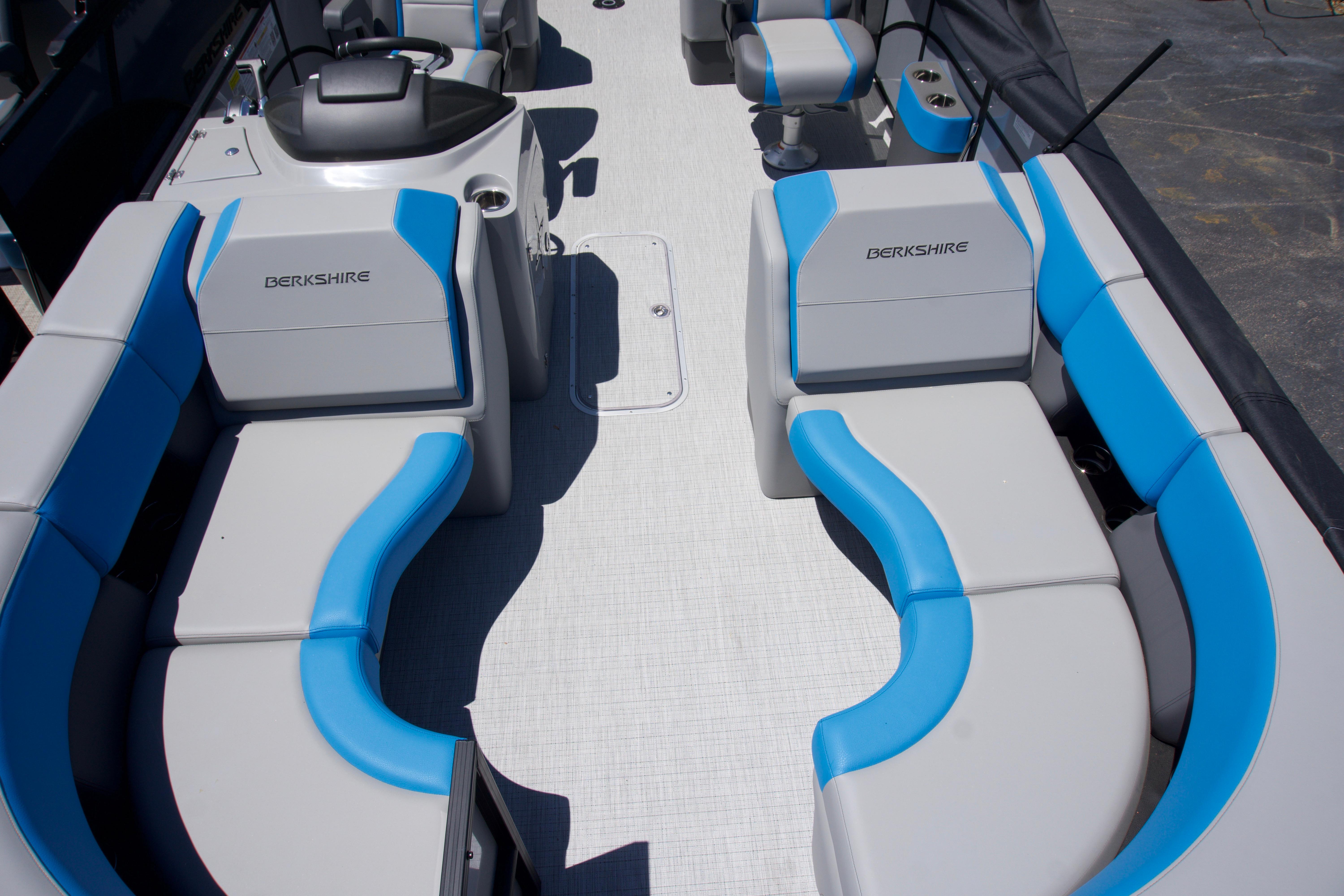 2024 Berkshire 23RFX-STS3 boat interior with blue and gray seating.