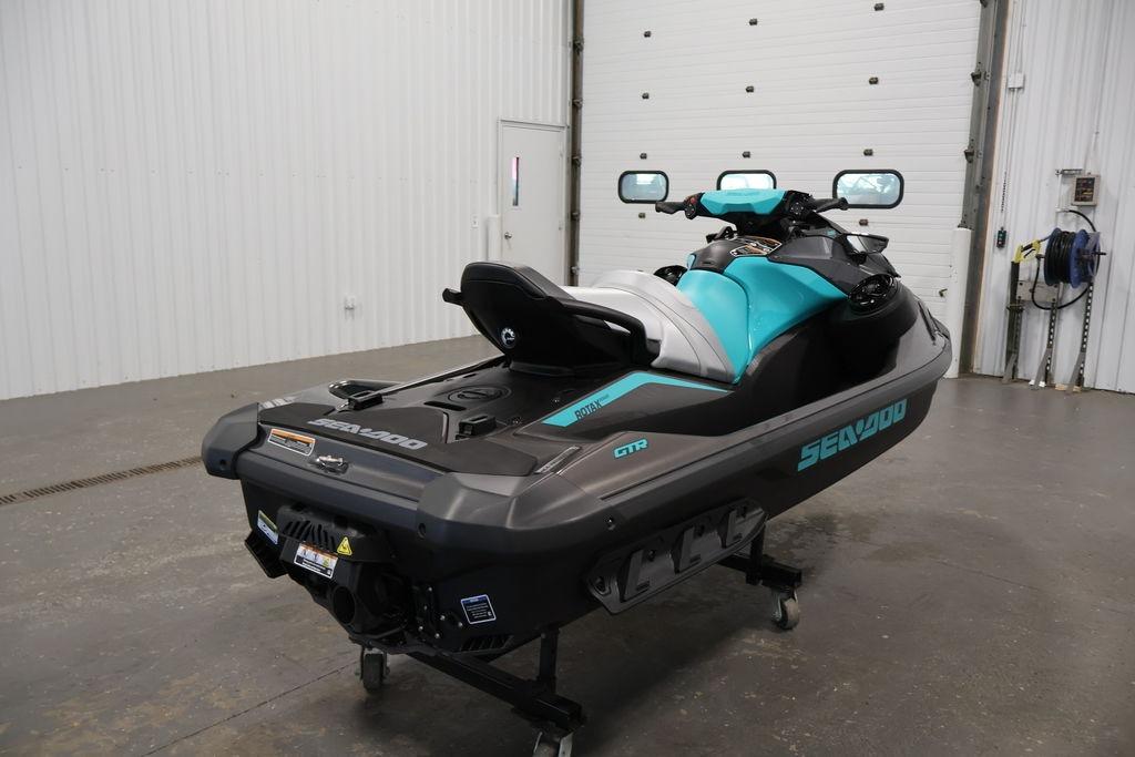 2026 Sea-Doo GTR 230 jet ski in a garage, showcasing sleek design and vibrant colors.