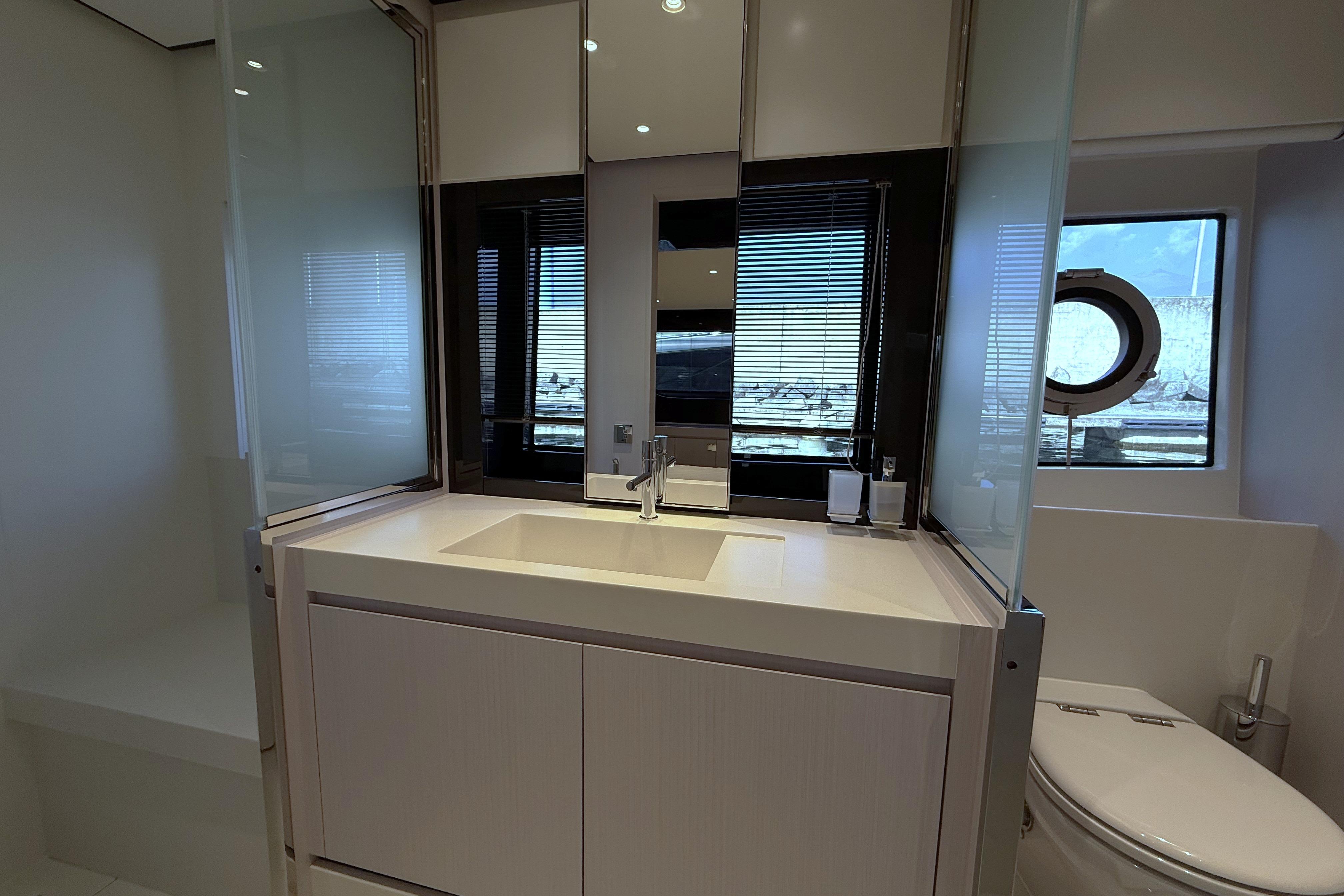 Luxurious bathroom interior of 2023 Riva 68 Diable yacht with modern fixtures.