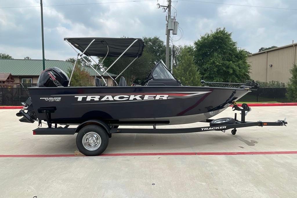 2026 Tracker Pro Guide V-175 Combo boat on trailer, parked outdoors.