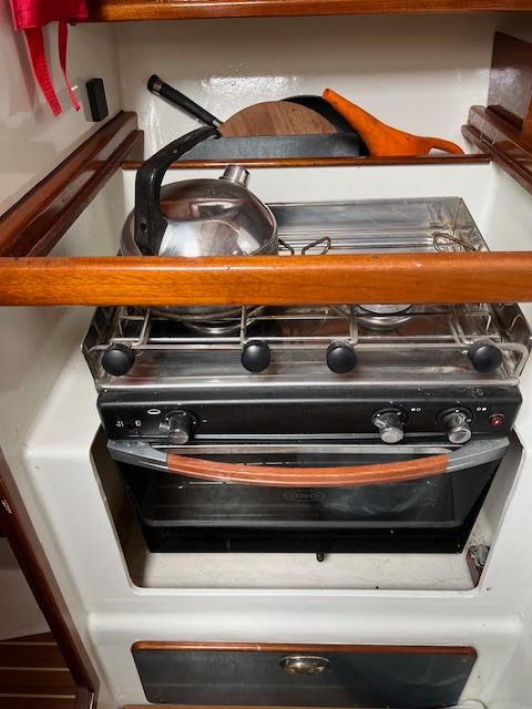 Compact kitchen stove with kettle and pan on a Custom 38 C/R boat, 2003 model.