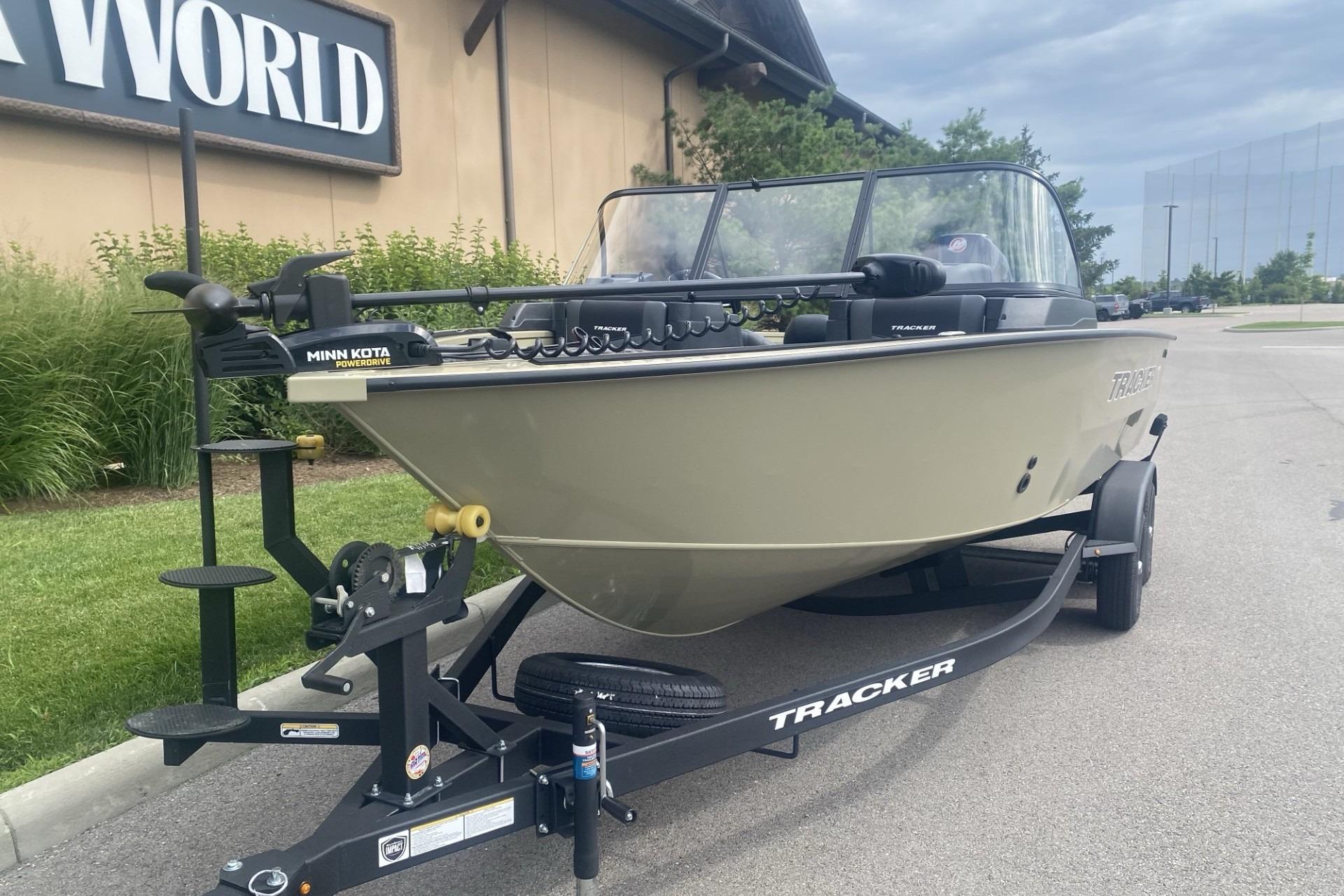 2026 Tracker Targa V-19 WT boat on trailer, parked outside a building.