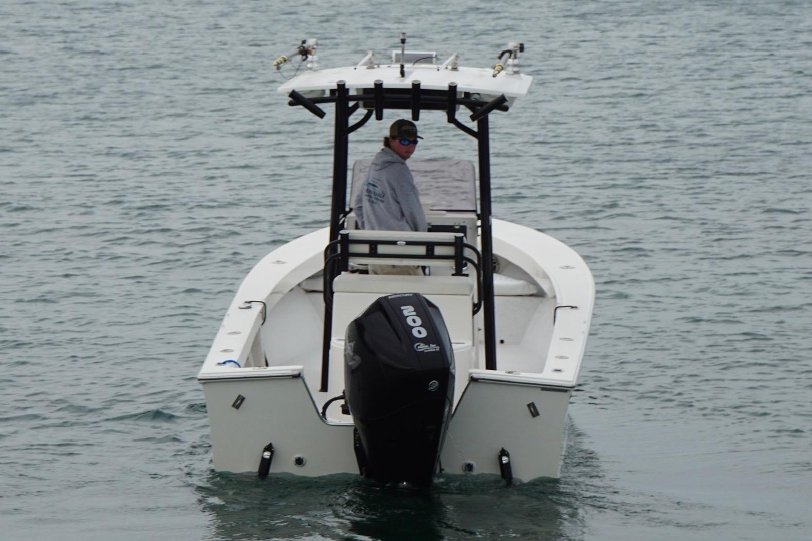 2020 May-Craft 23 Cape Classic boat on water, rear view with outboard motor.