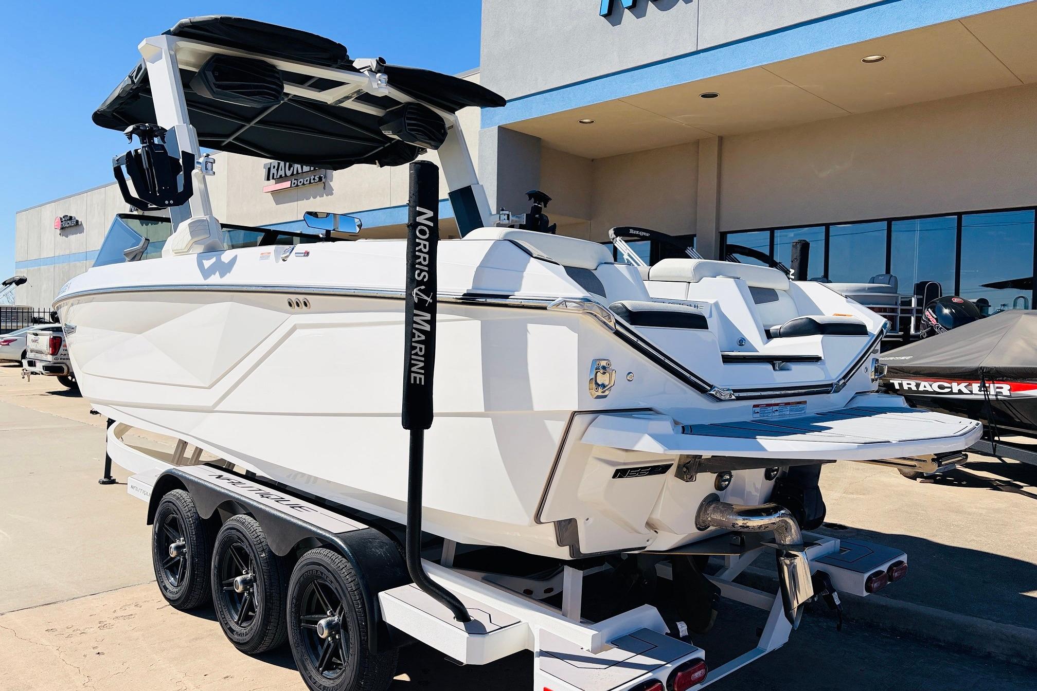 2023 Nautique Super Air Nautique G25 boat on trailer at dealership.