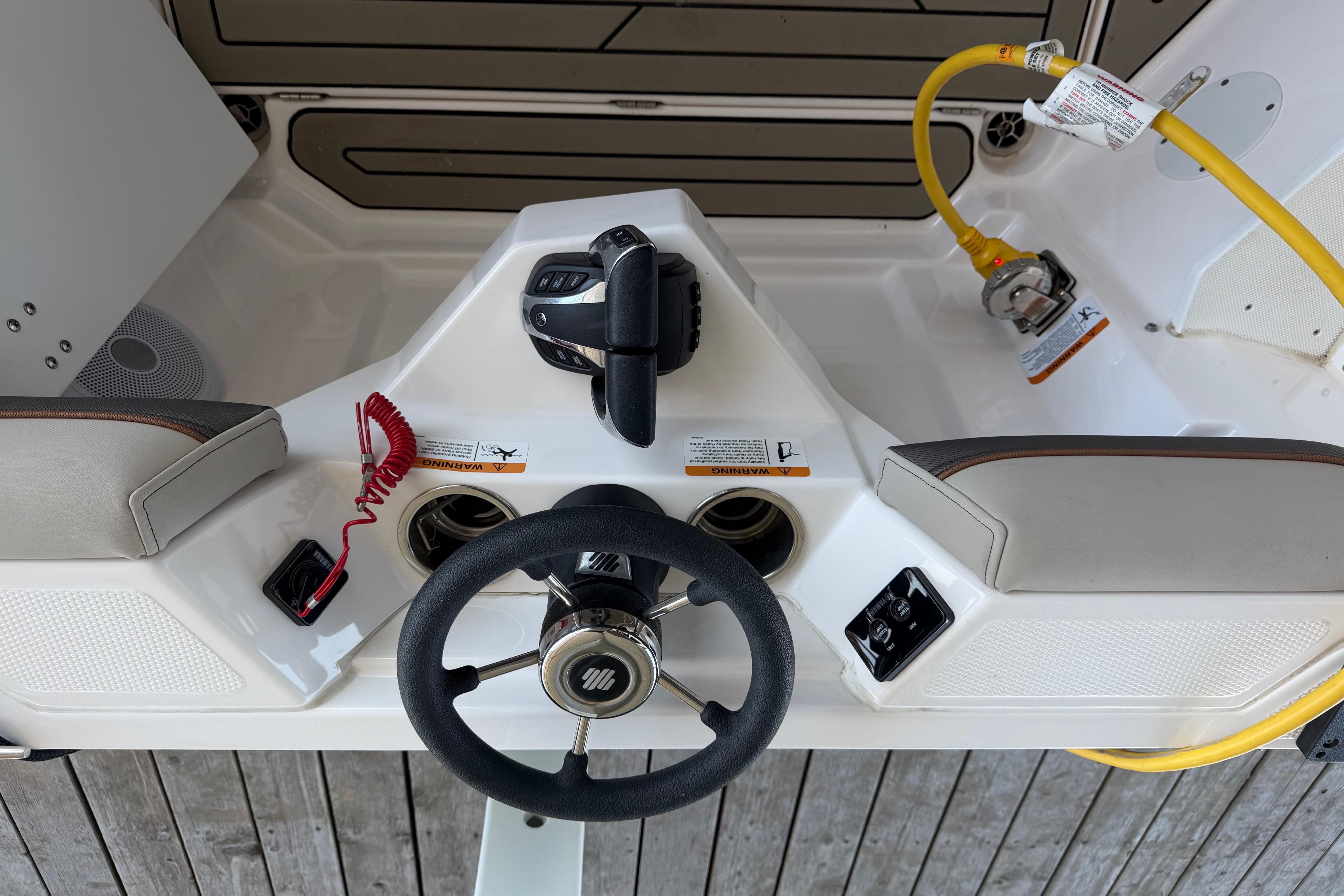 Helm of 2023 Cutwater C-288 Coupe with steering wheel and controls.