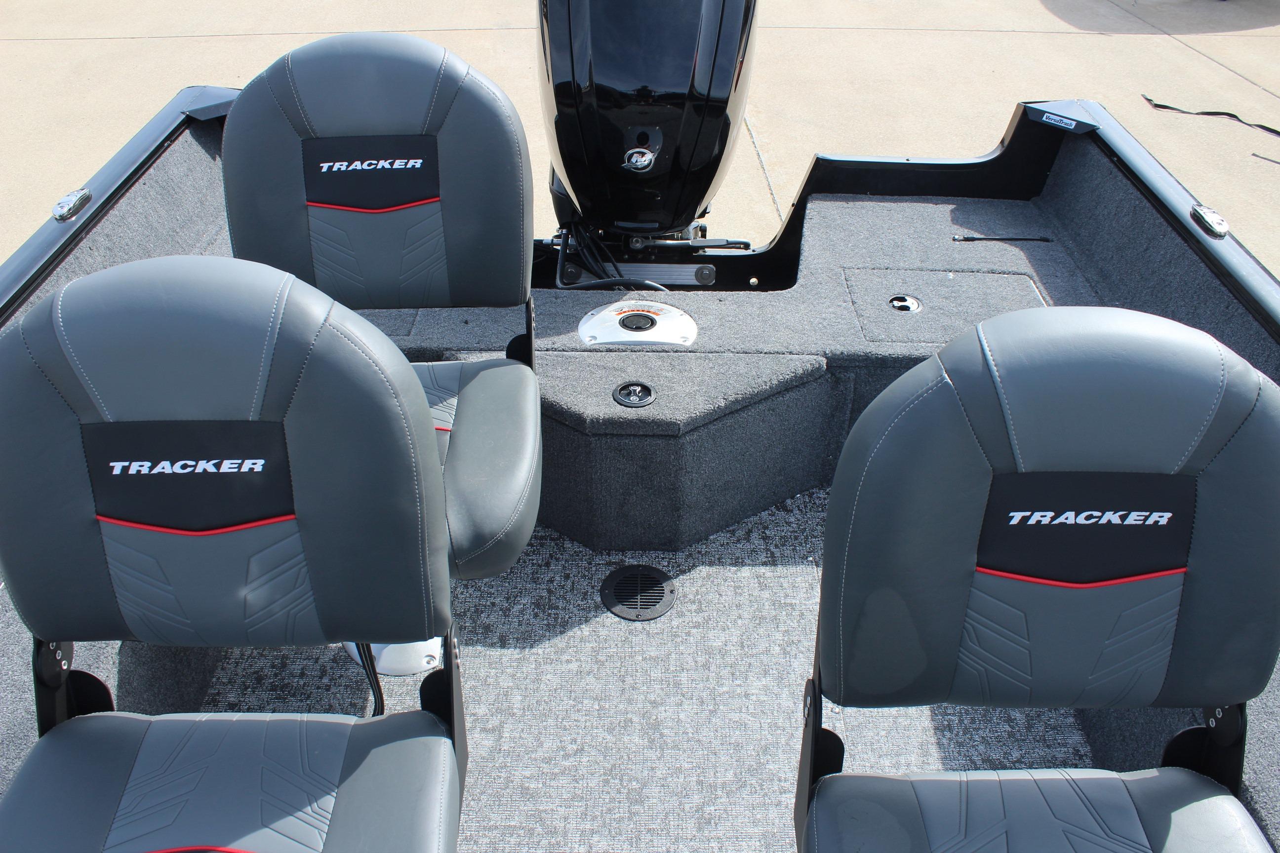 2026 Tracker Pro Guide V-16 WT boat interior with gray seats and motor.