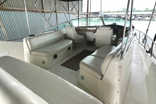 2004 Carver 360 Mariner boat interior with white seating and helm station.