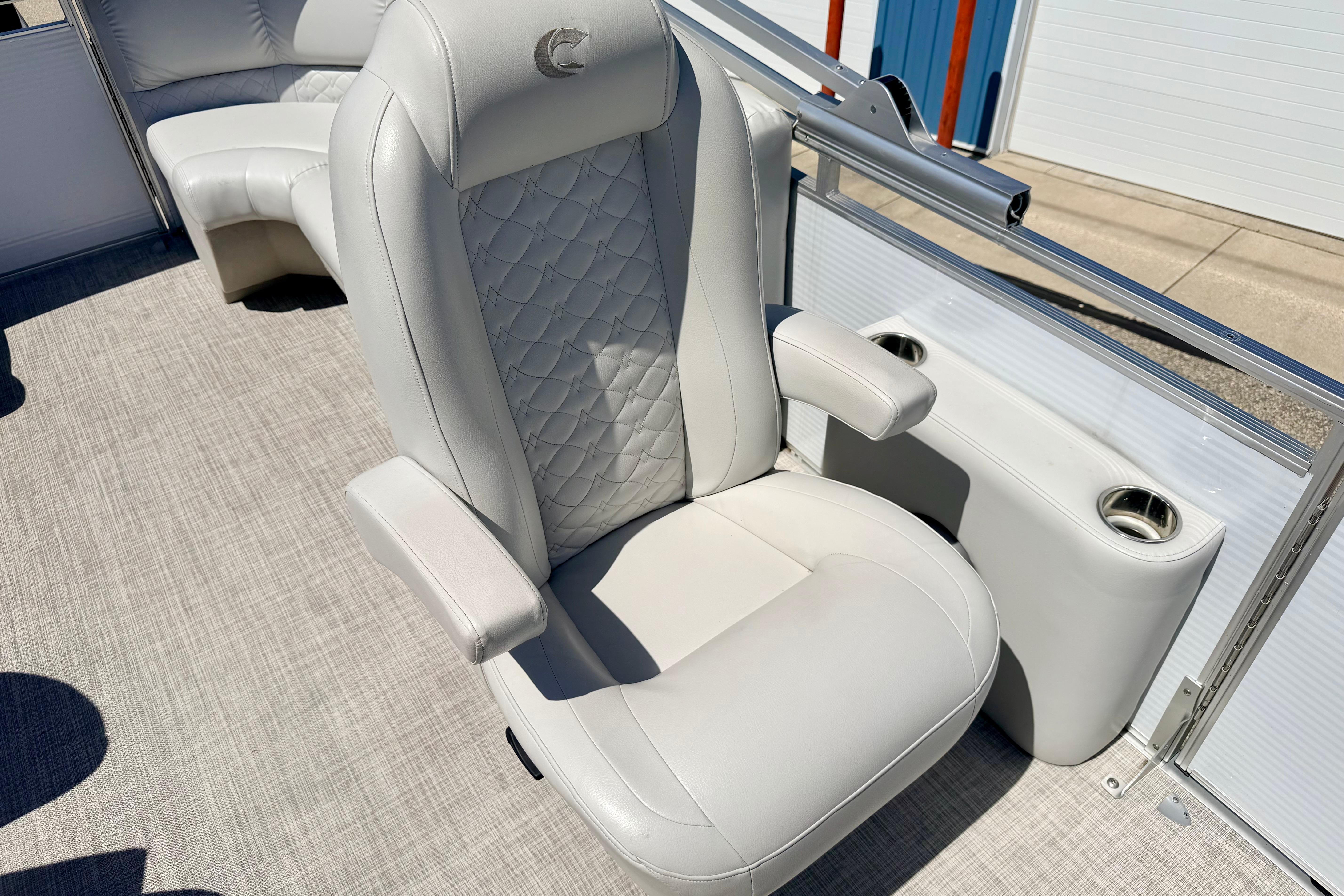 2019 Crestliner 240 Rally DX CW boat seat with quilted design and cup holders.