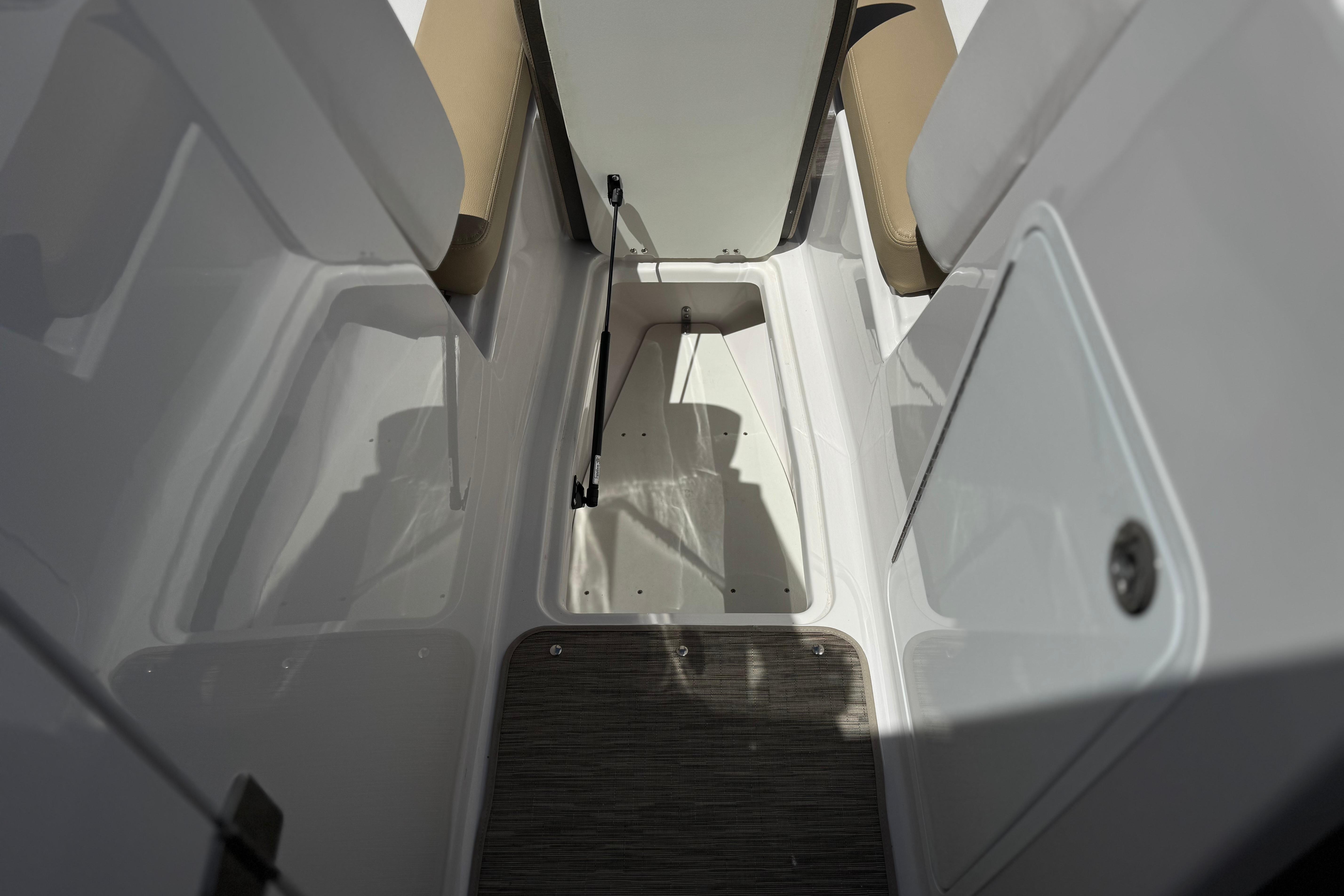 Interior view of 2017 Scarab 255 H.O. Platinum boat showing seating and storage area.