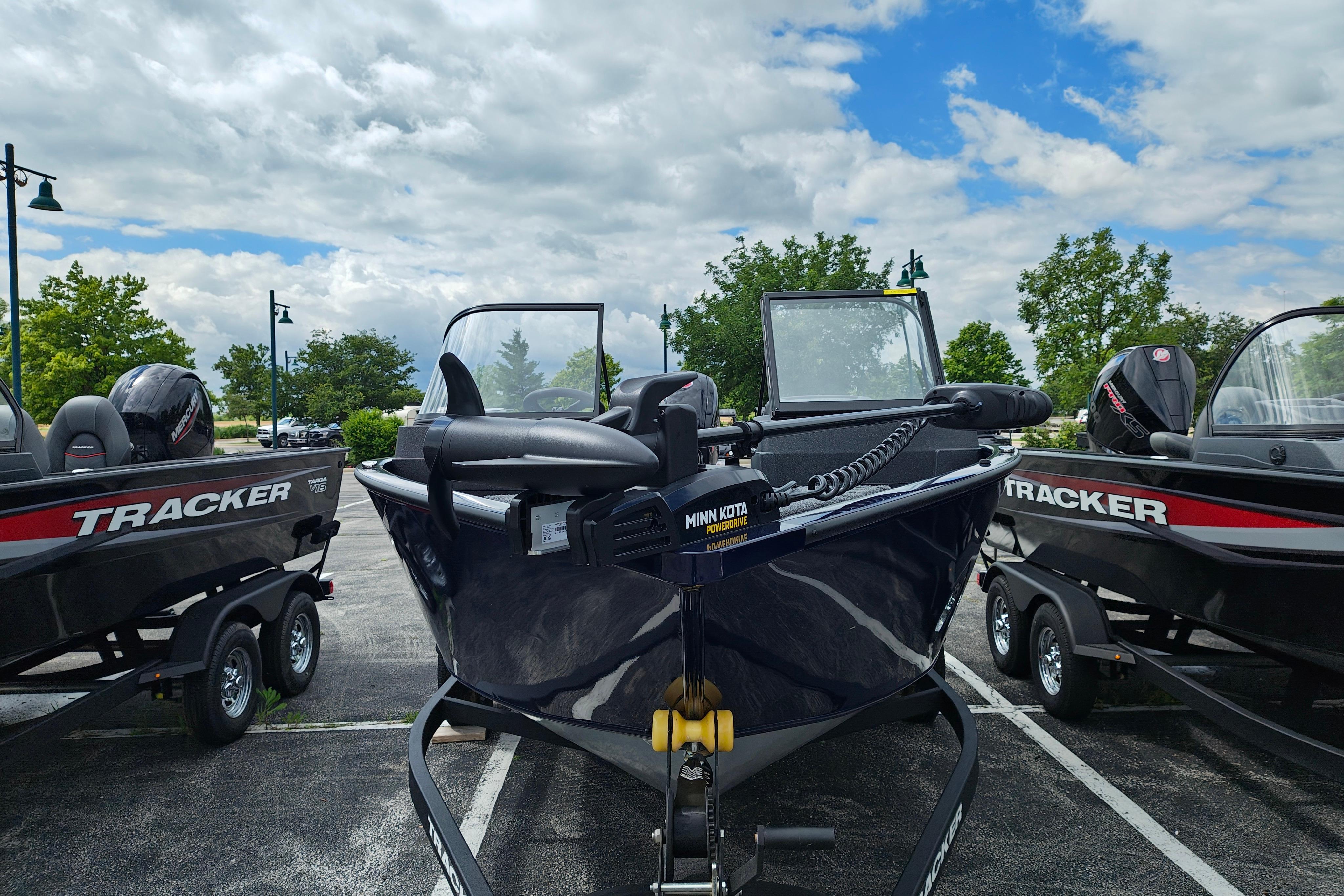 2026 Tracker Pro Guide V-175 WT boat on trailer under cloudy sky.