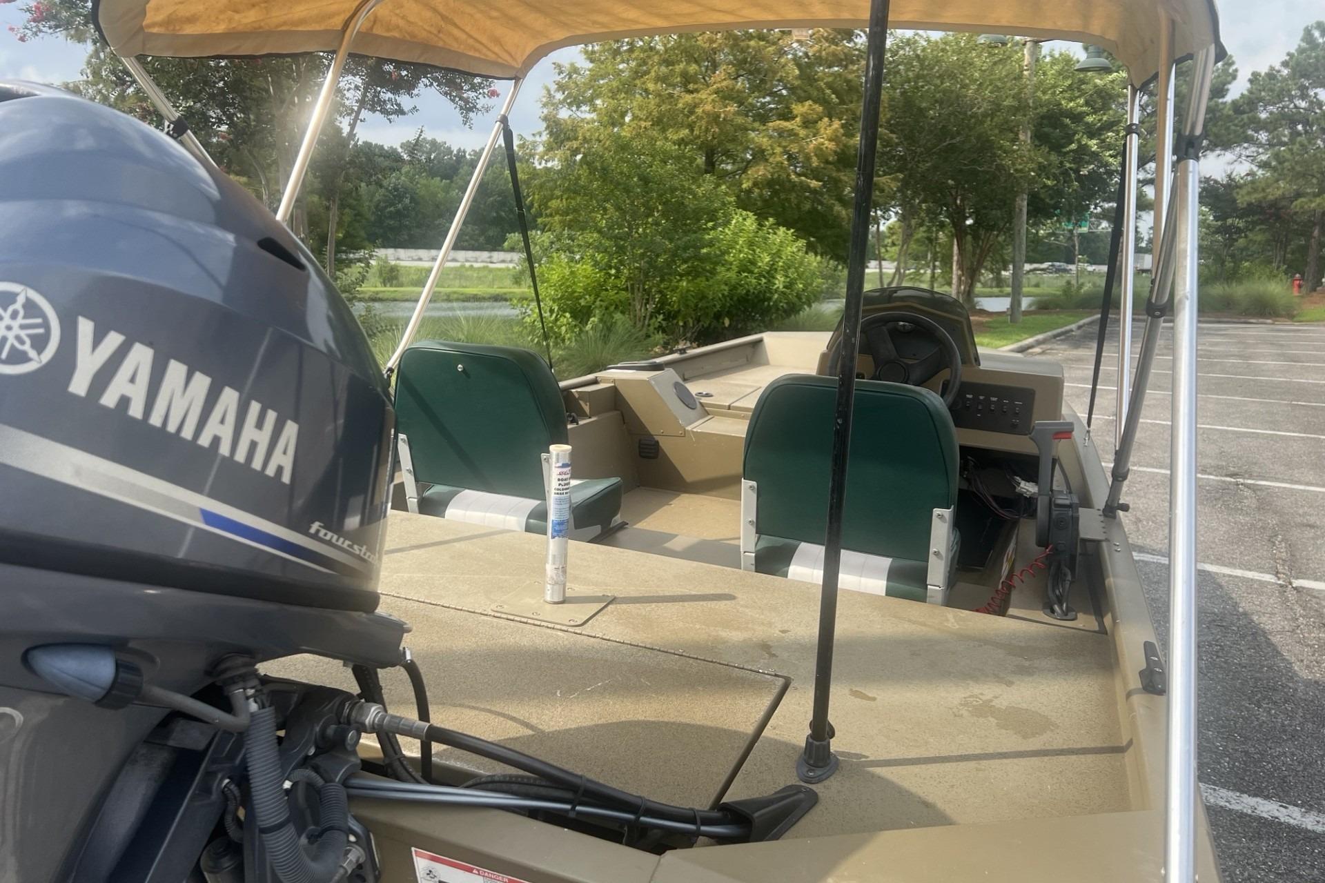 2016 G3 1756 SC boat with Yamaha outboard motor, parked outdoors.