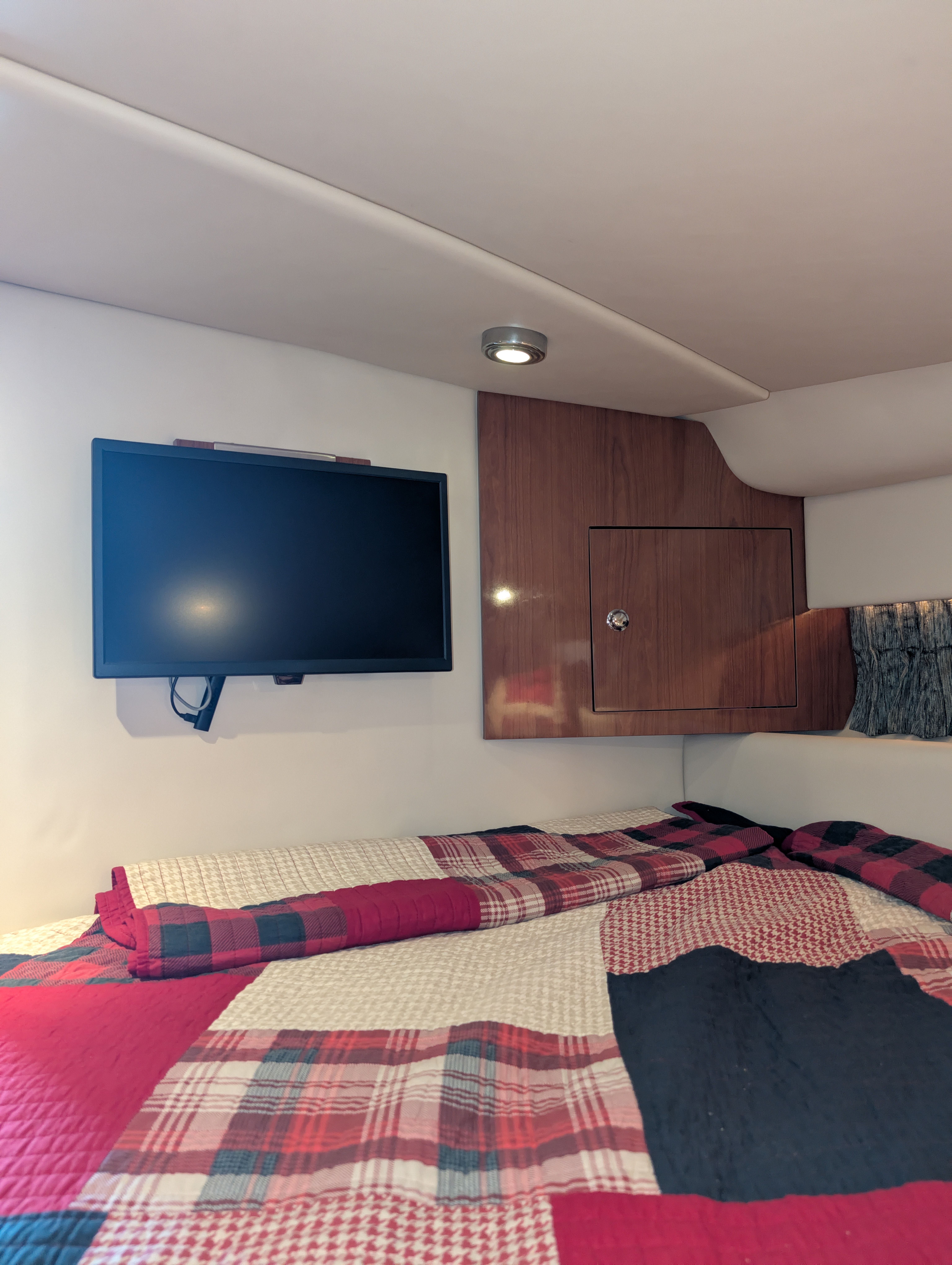 Interior of a Regal Commodore 3560 yacht with bed and TV.