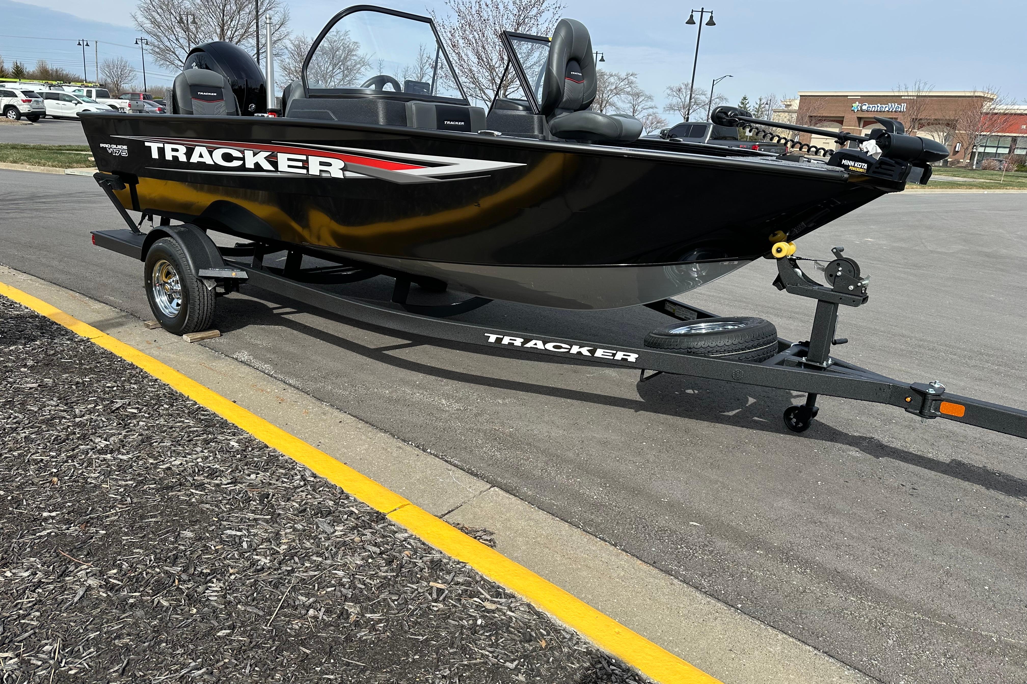 2026 Tracker Pro Guide V-175 Combo boat on trailer in parking lot.