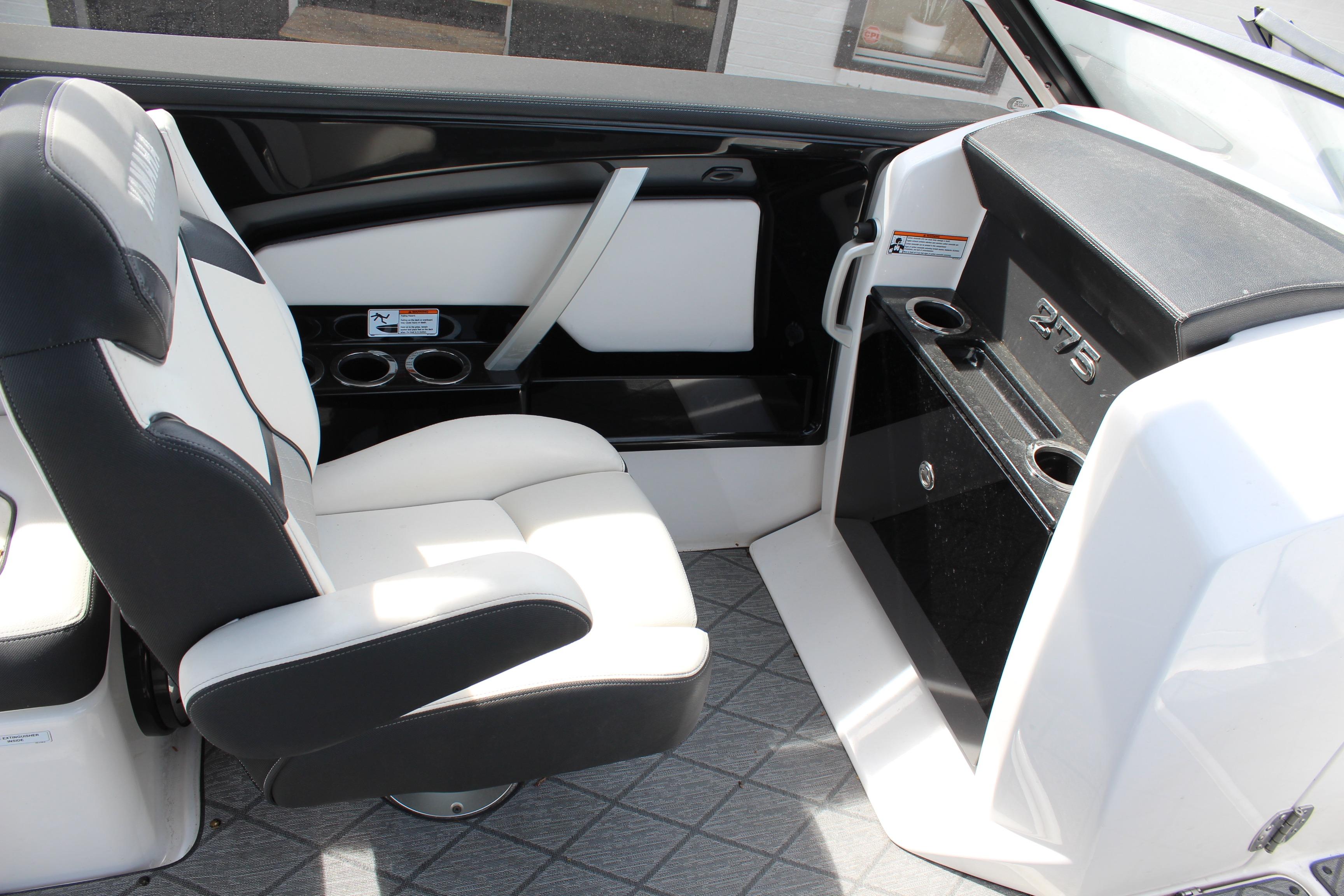 Interior of 2020 Yamaha Boats 275SE, featuring sleek seating and modern dashboard design.