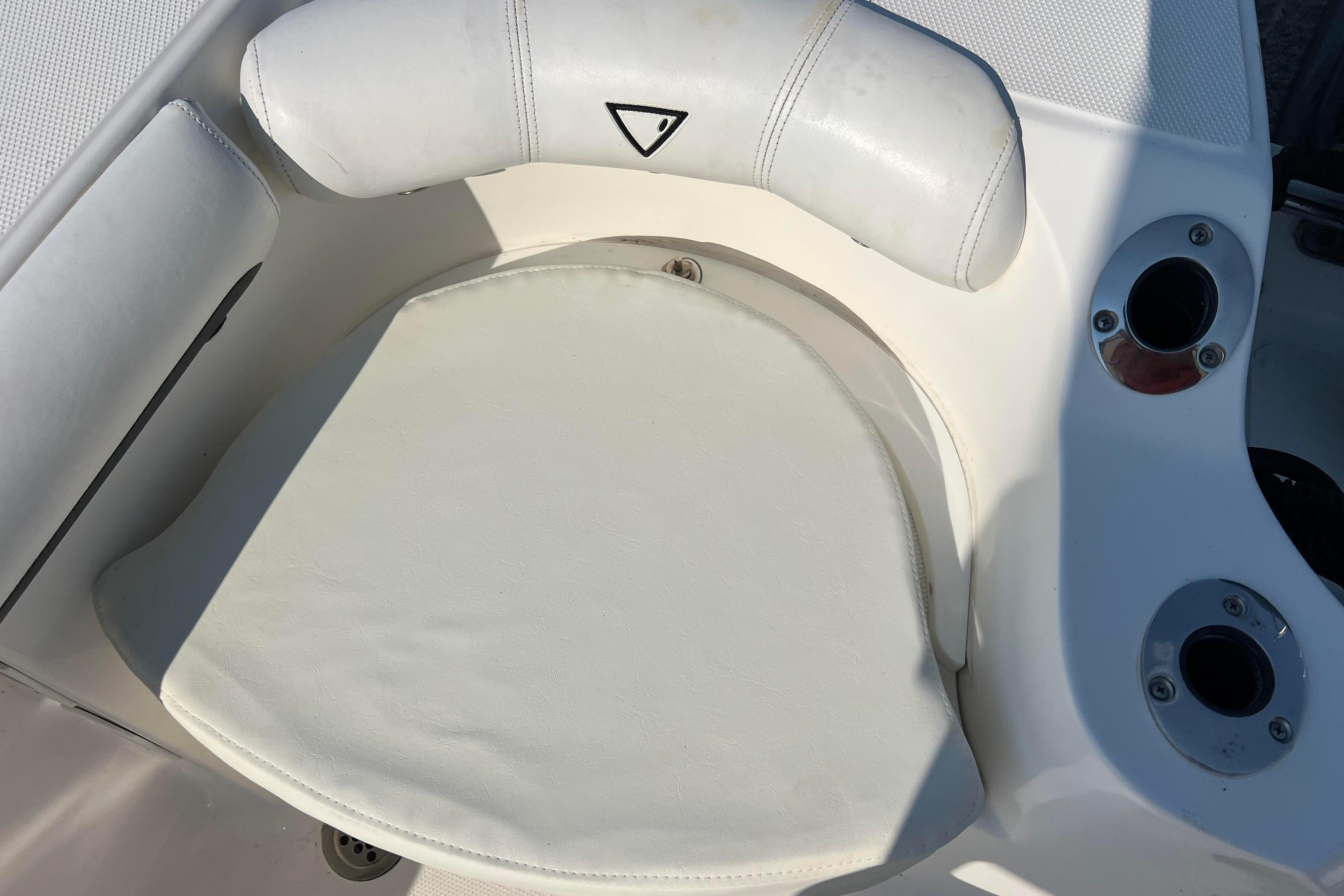 White cushioned seat on a 2012 Sea Fox 206 Center Console boat.