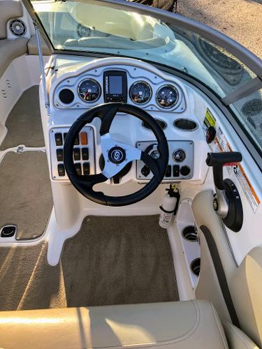 Interior view of a 2012 Godfrey Hurricane boat cockpit.
