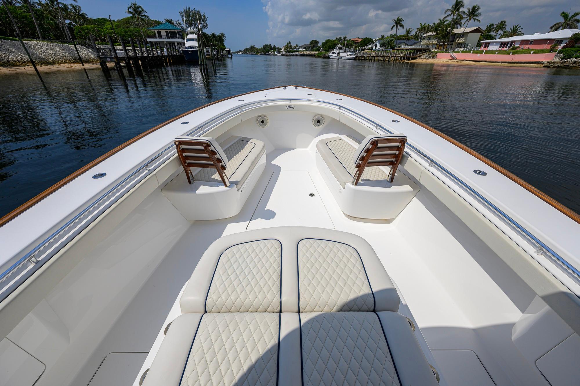 2020 Valhalla Boatworks V-41 with luxurious seating on a serene waterway.