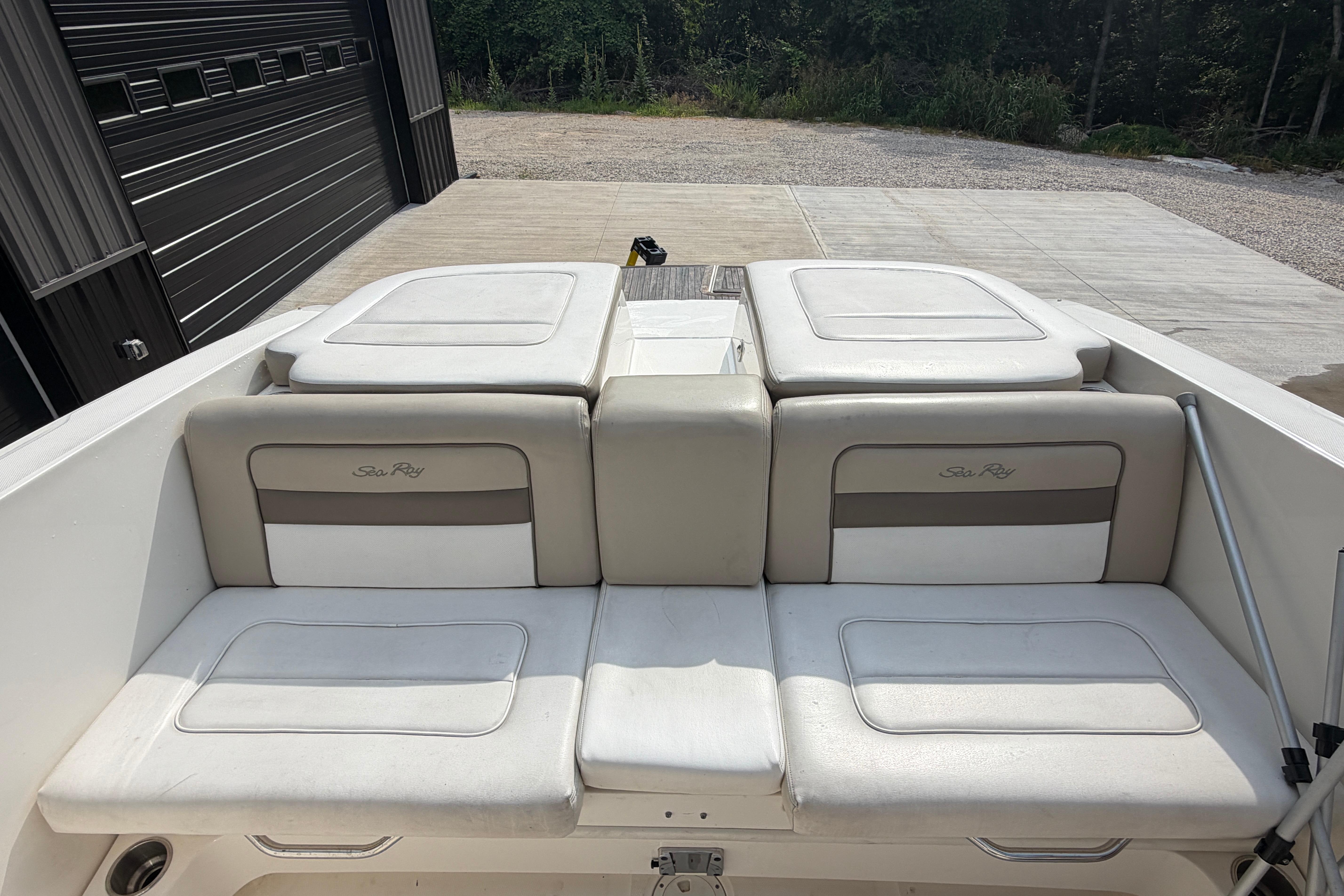 2013 Sea Ray 300 SLX boat interior with cushioned seating and storage compartments.