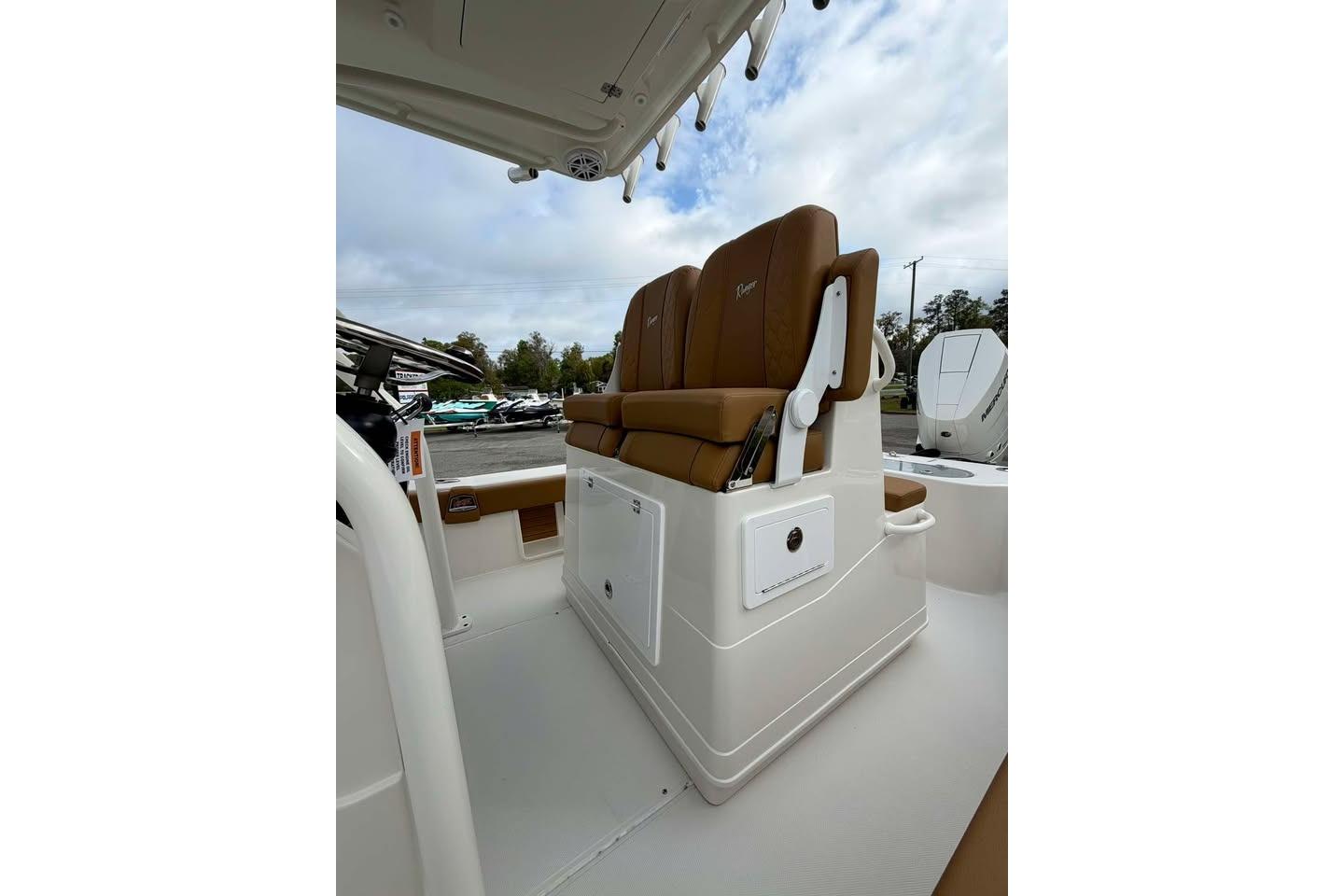 2026 Ranger 2600 Bay boat with tan seating and storage compartments.