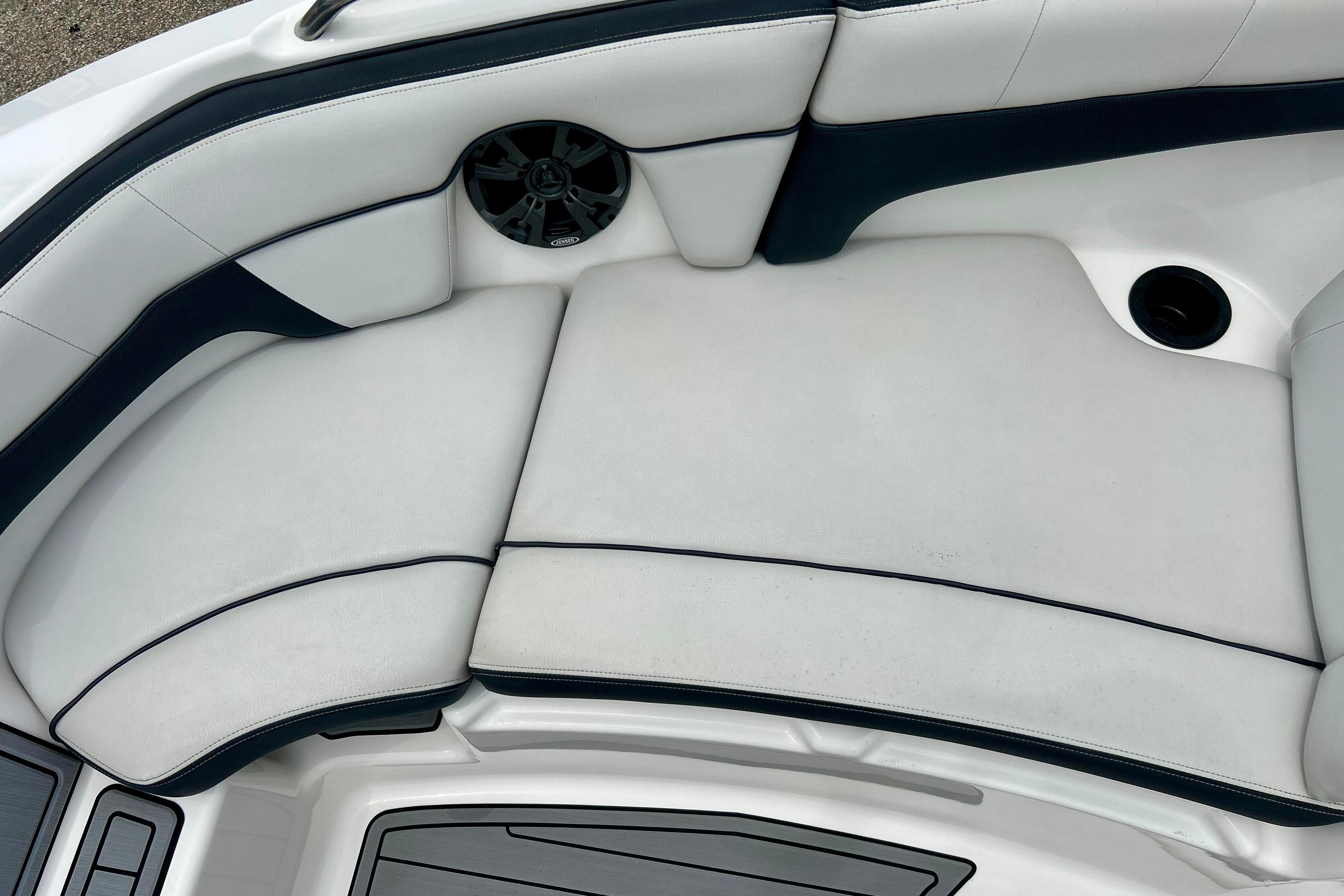 2015 Yamaha Boats AR210 interior seating with speaker and cup holder.