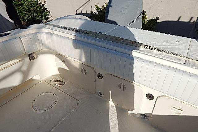 2003 World Cat 270 EC boat interior with white seating and storage compartments.