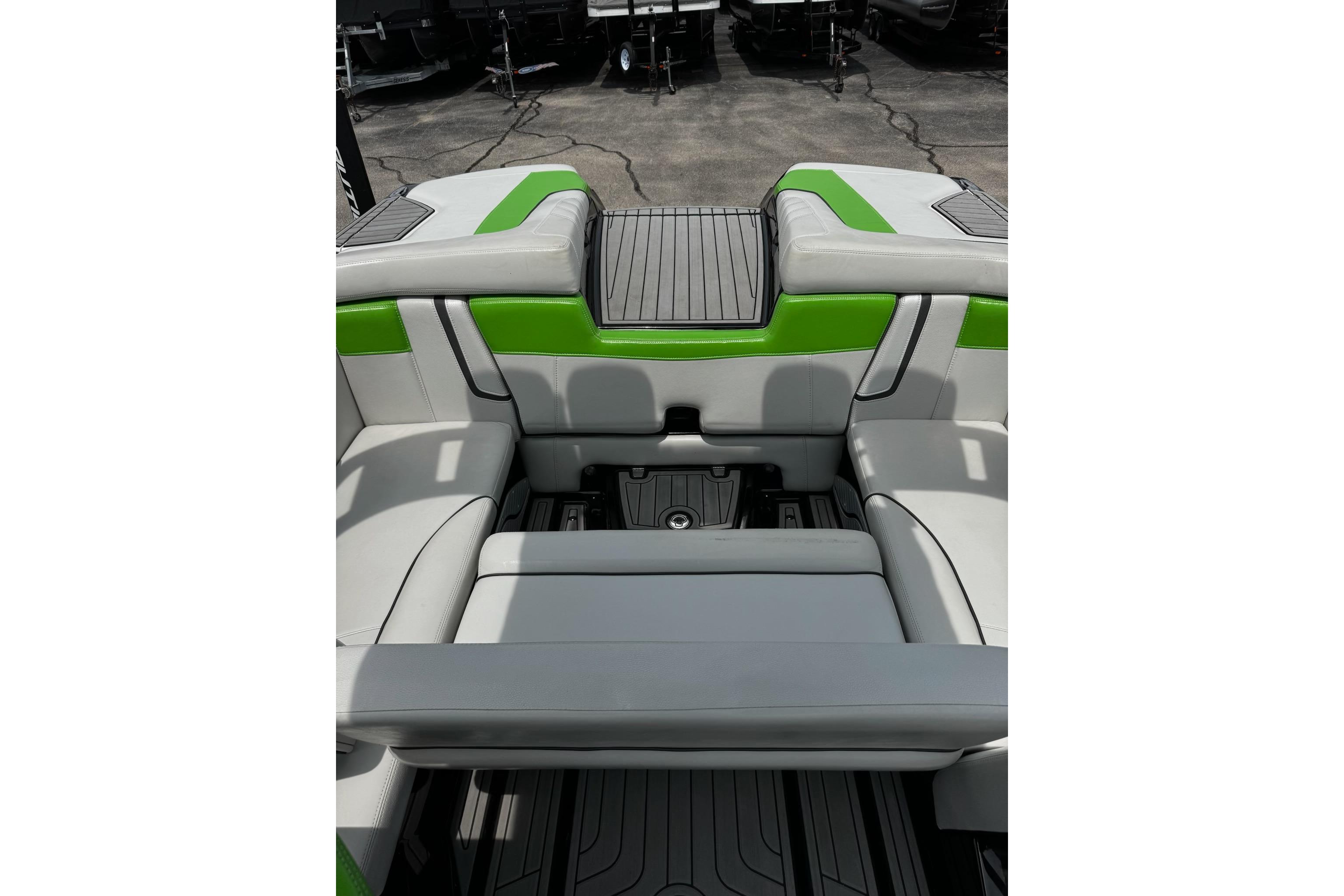 2014 Nautique Super Air Nautique G21 interior with green and gray seating.