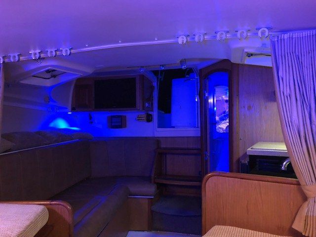 Interior of the 2005 Luhrs 32 Open with blue lighting.