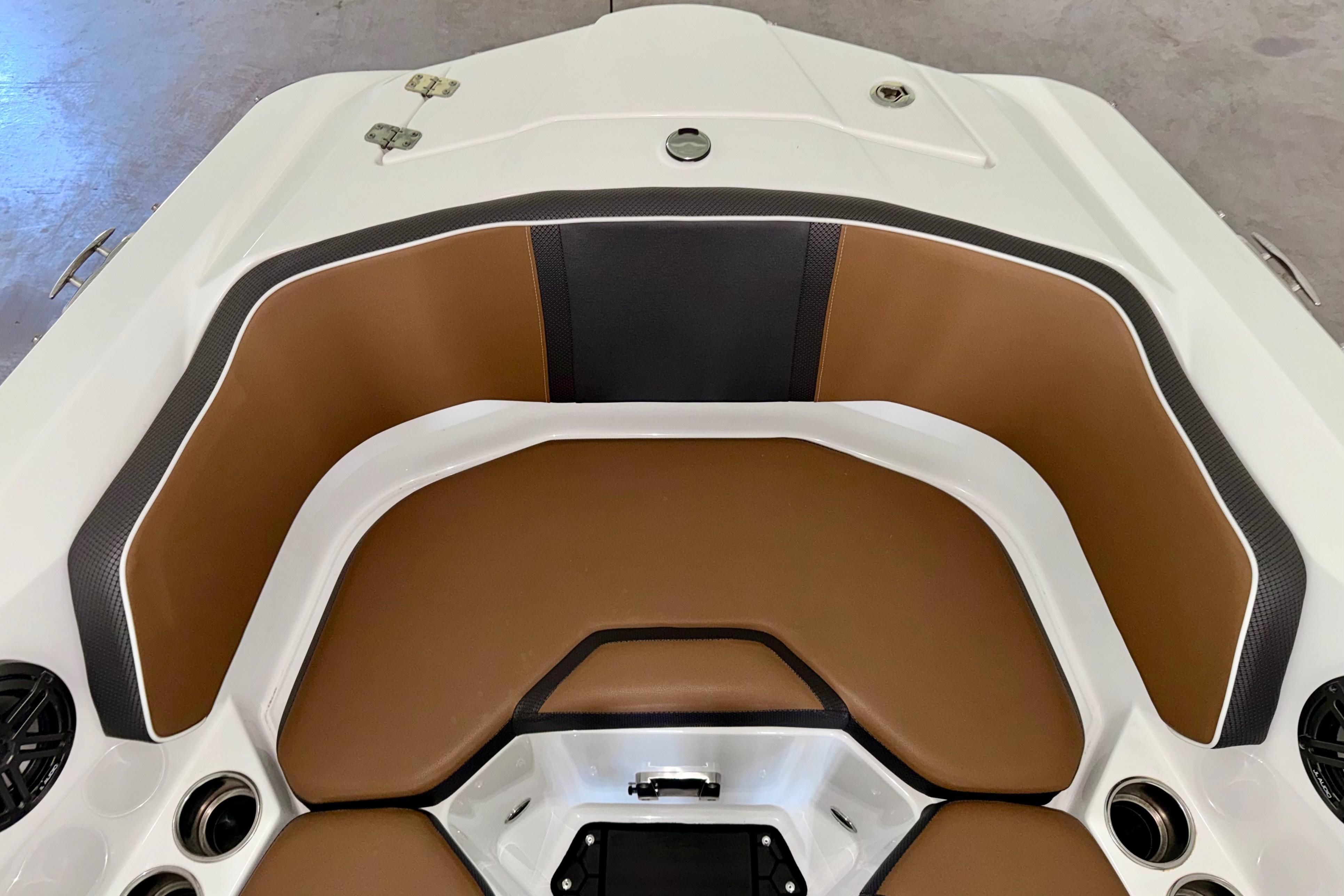 2023 Scarab 255 ID boat interior with brown and black seating.