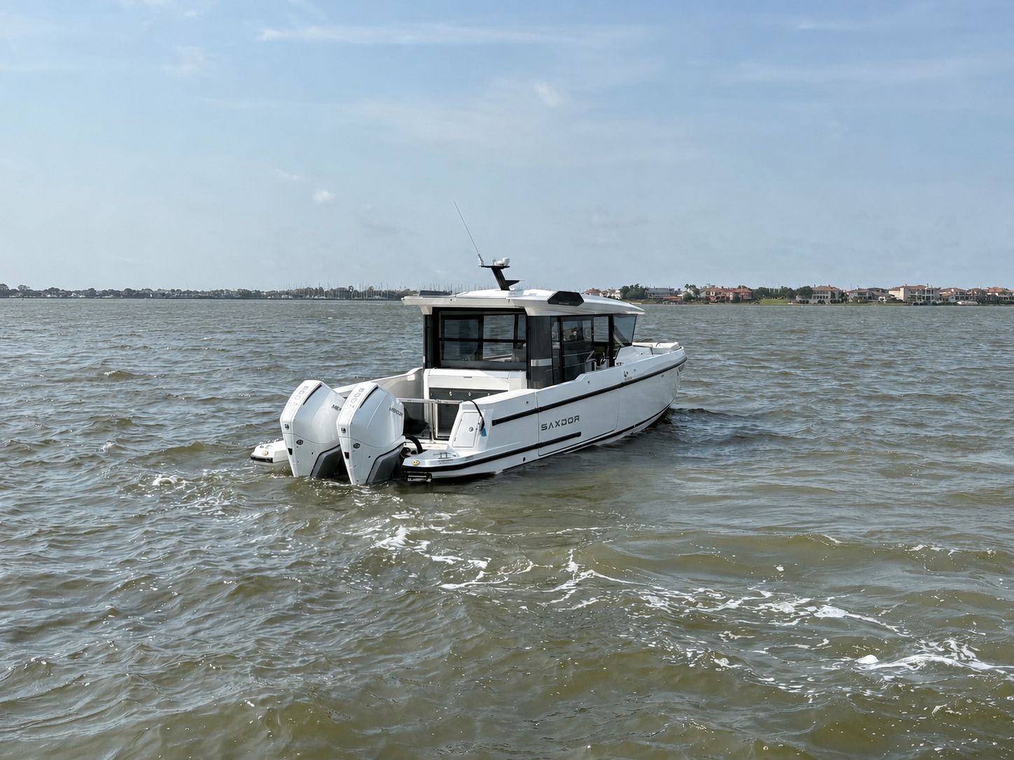 Saxdor 340 GTWA 2026 on open water, modern motorboat view.