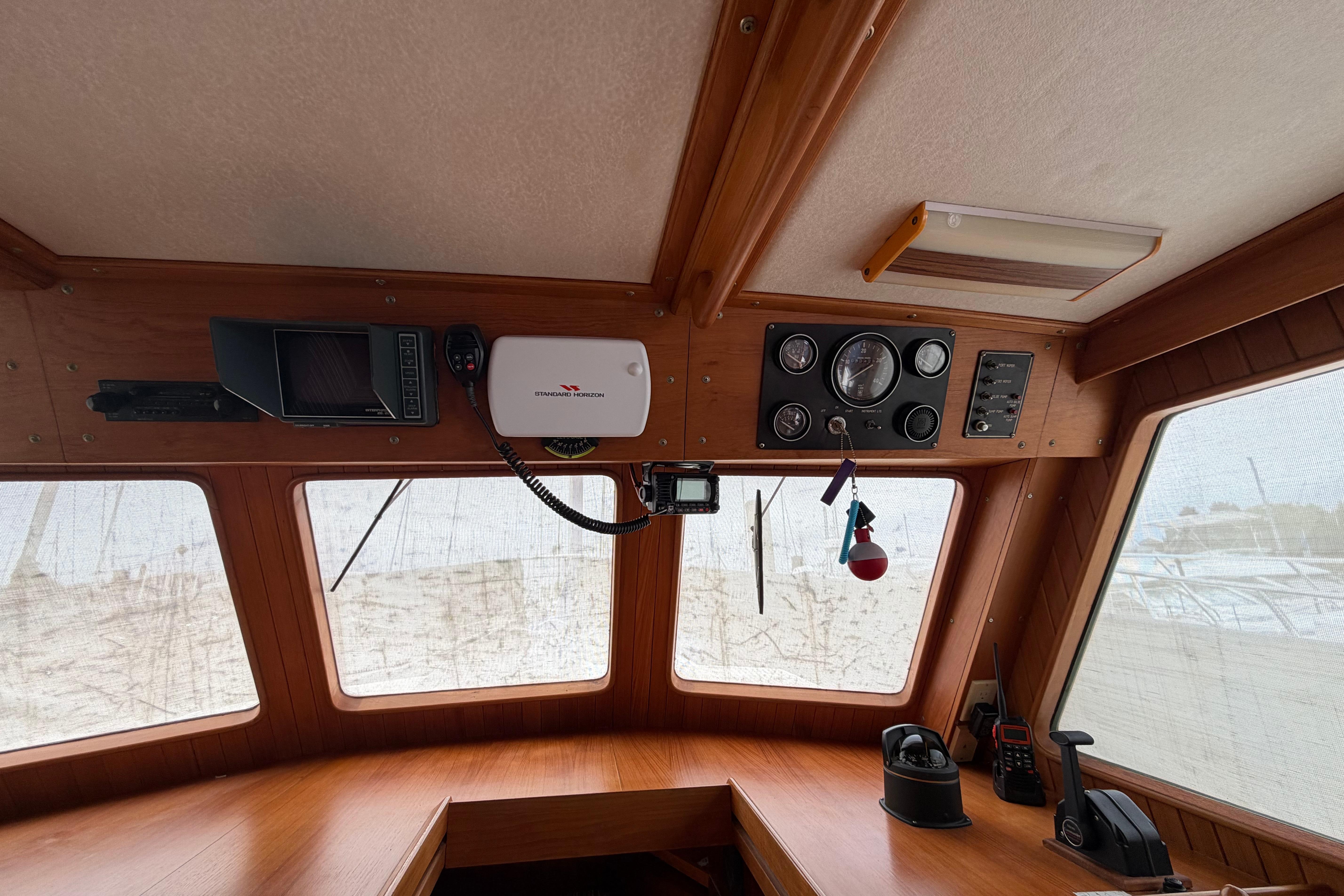 Interior of a 1988 Monk 36 boat cockpit with navigation instruments and controls.