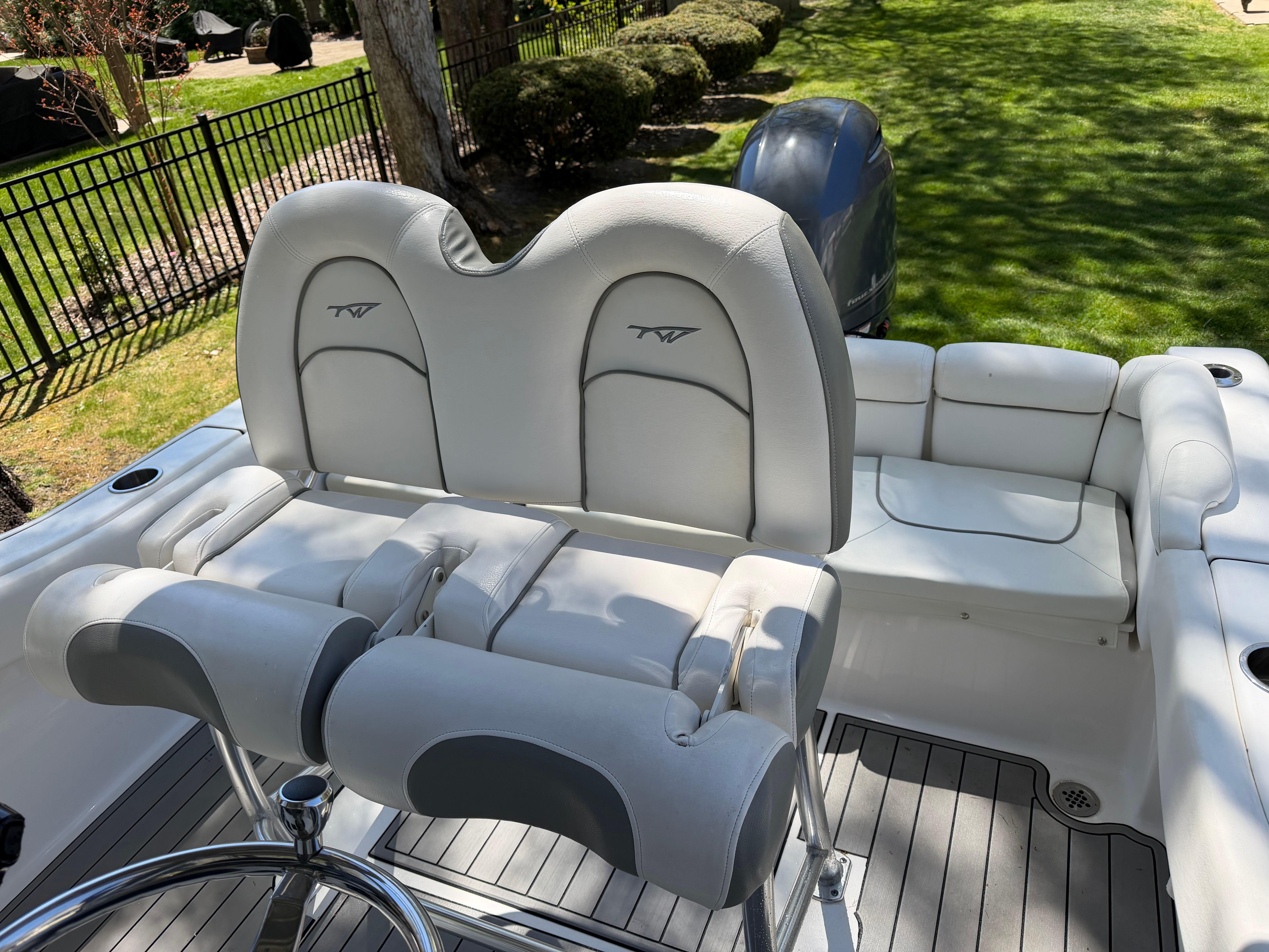 Interior of a 2016 Tidewater 210 LXF boat with white seating.