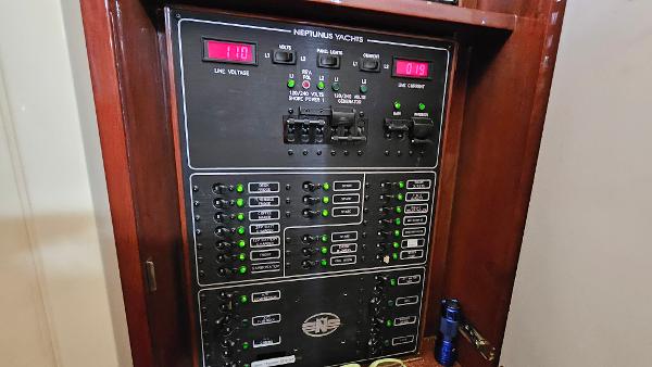 Electrical panel of 2005 Neptunus 56 Flybridge yacht, showing voltage and current displays.