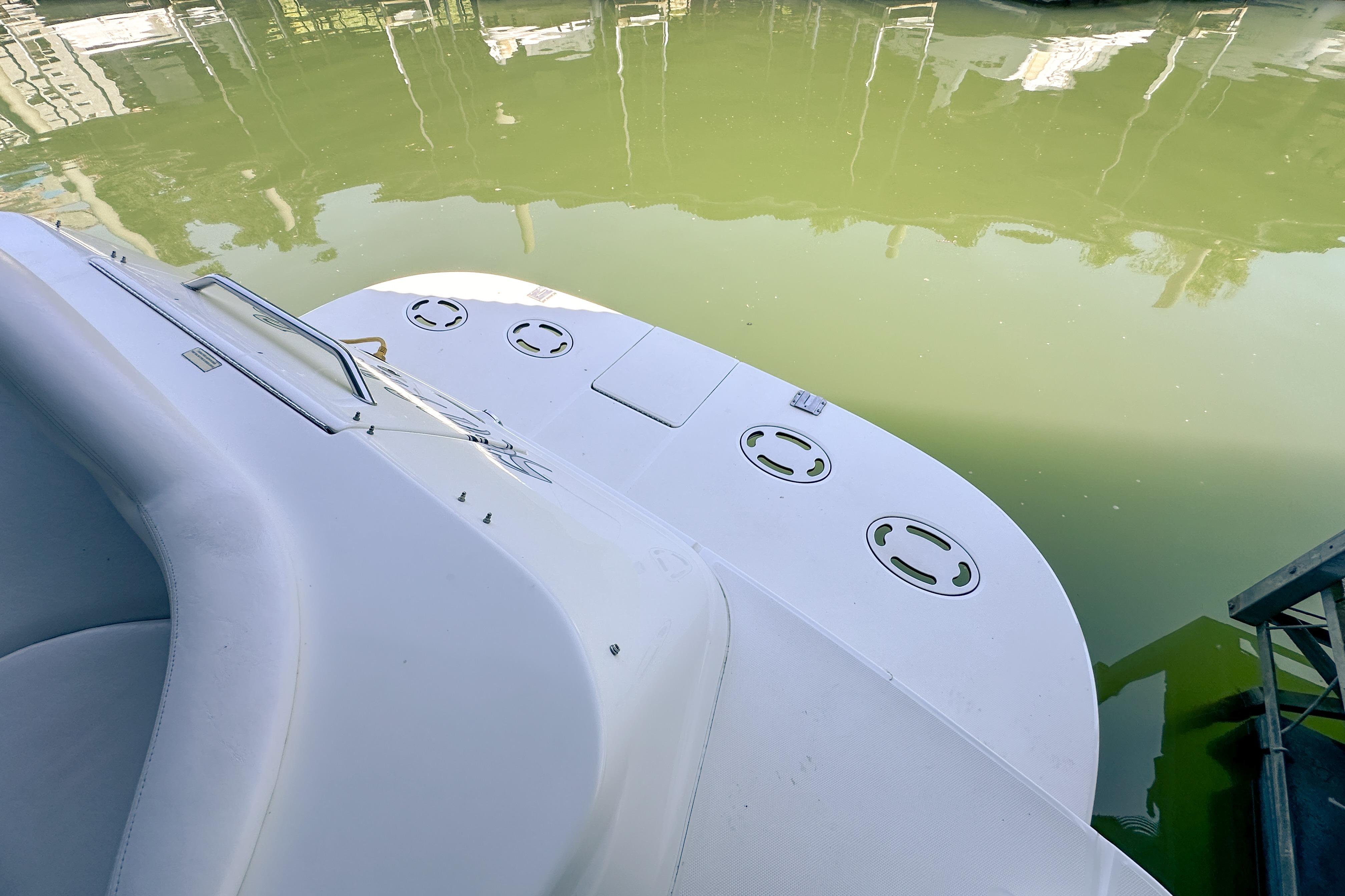 2001 Sea Ray 410 Sundancer boat deck by calm water.