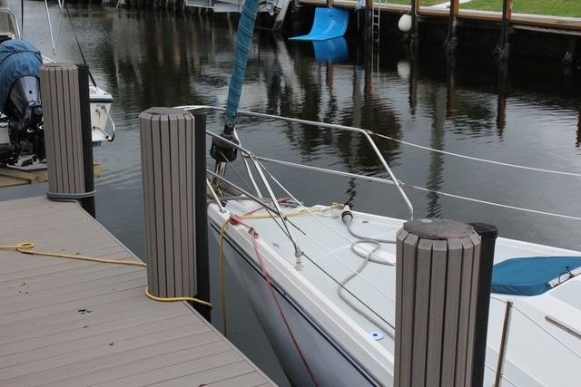 1989 Catalina 42 sailboat docked in a calm marina setting.