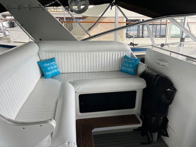 Interior of a 1989 Trojan 370 Express with white upholstery.