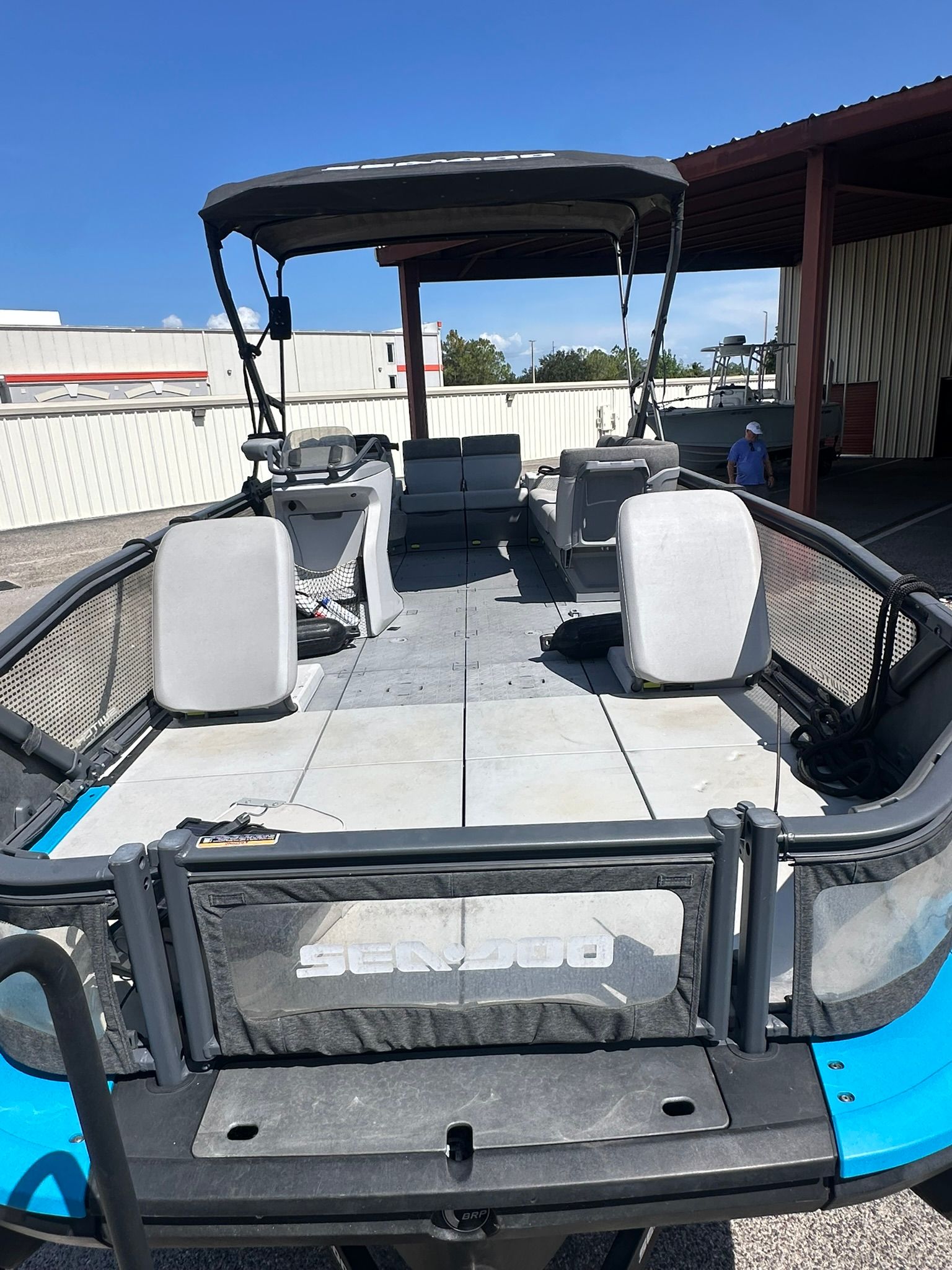 A 2023 Sea-Doo 21 SWITCH SPORT with a spacious deck and seating.