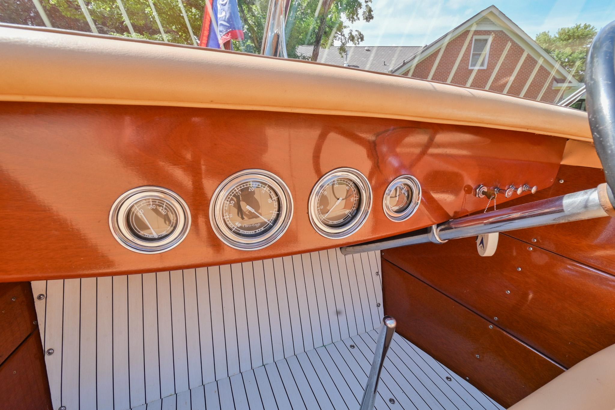 1942 Chris-Craft 17 boat dashboard with vintage gauges and wooden finish.