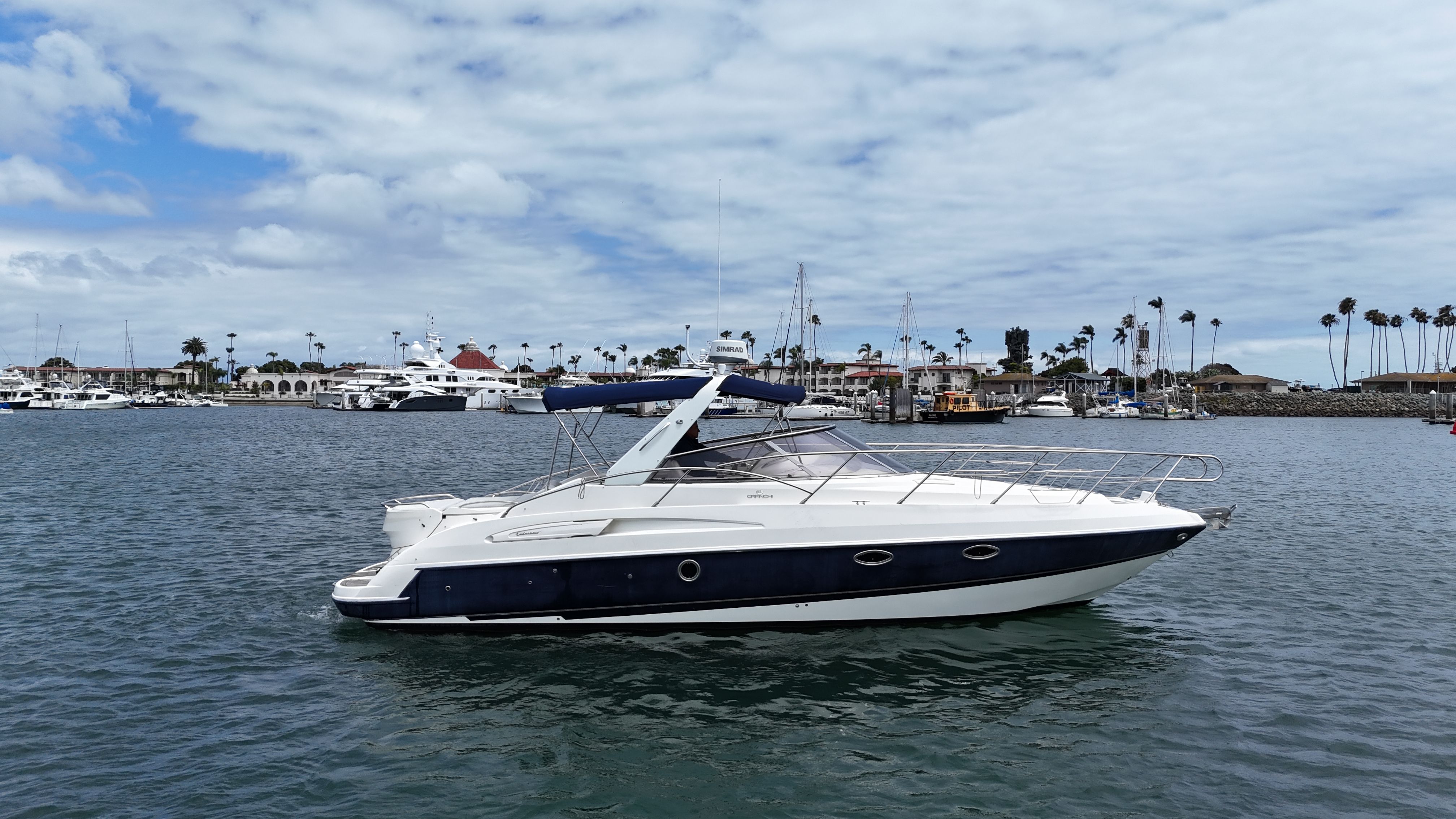 2005 Cranchi 33 Express yacht anchored in harbor.
