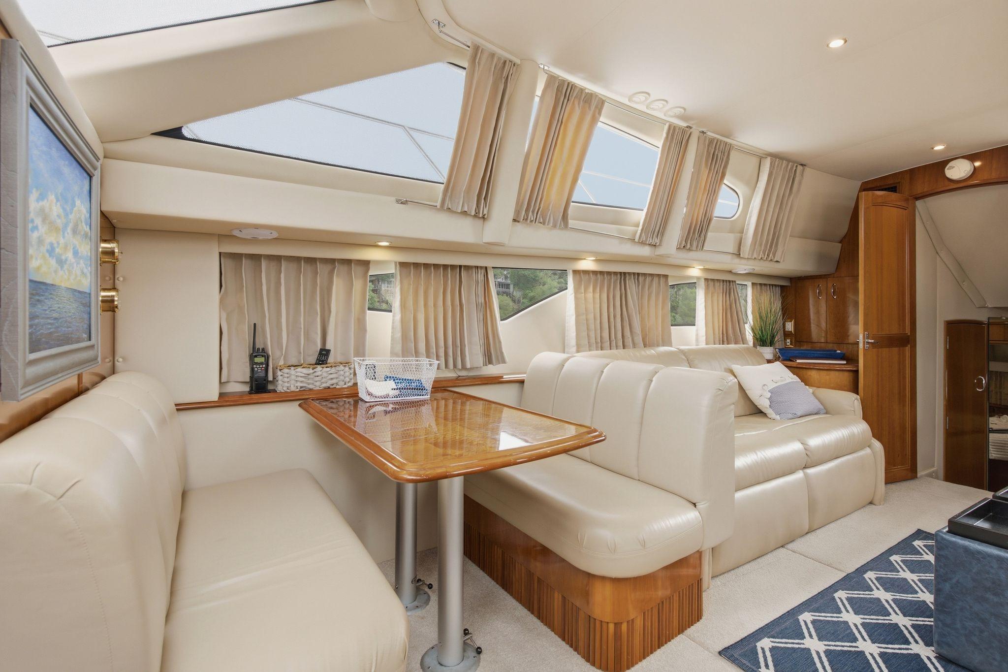 Luxurious interior of 2005 Carver 39 Motor Yacht with plush seating and elegant decor.