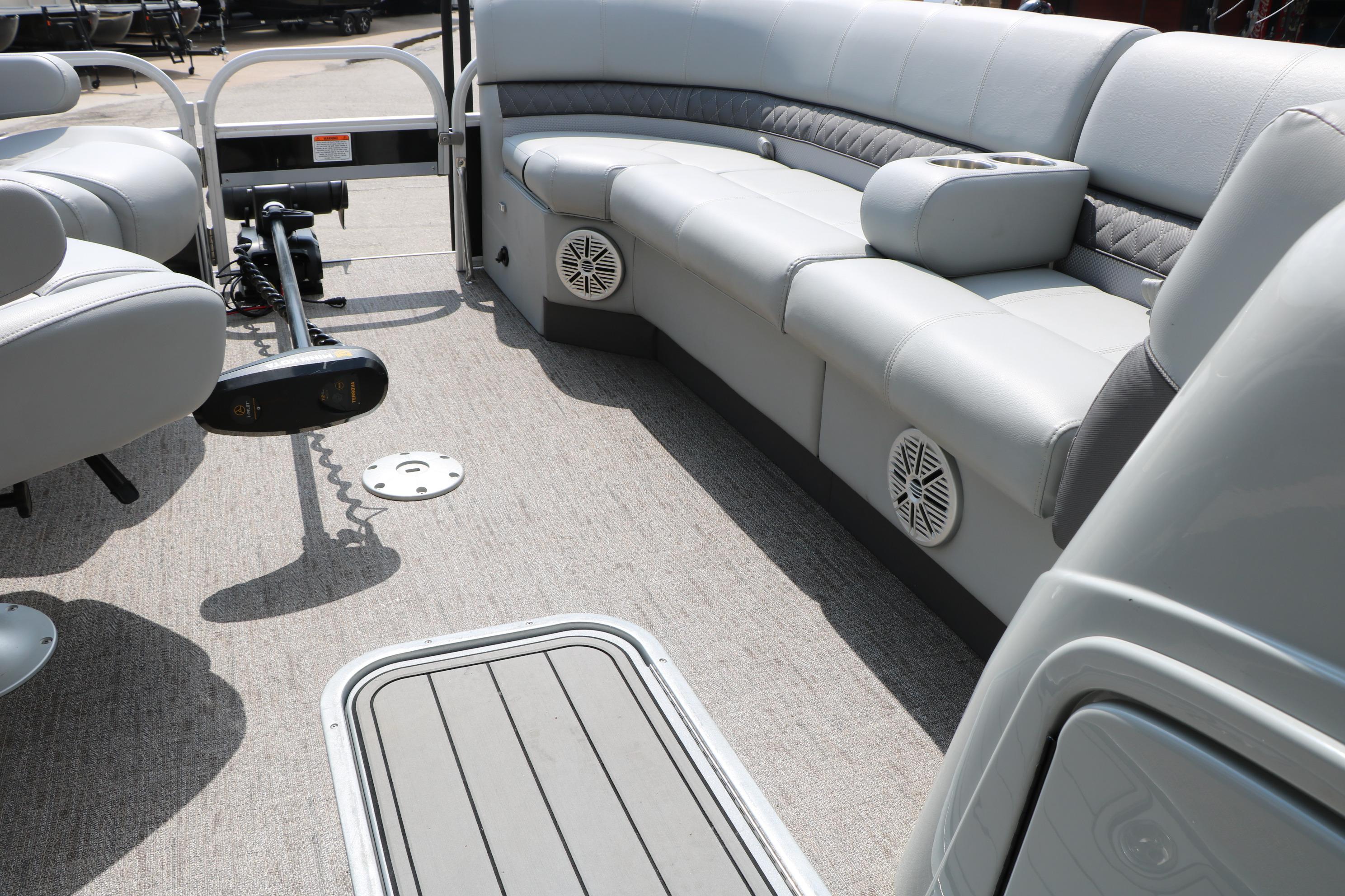 Interior of a 2021 Ranger 223FC boat with gray seating and modern amenities.