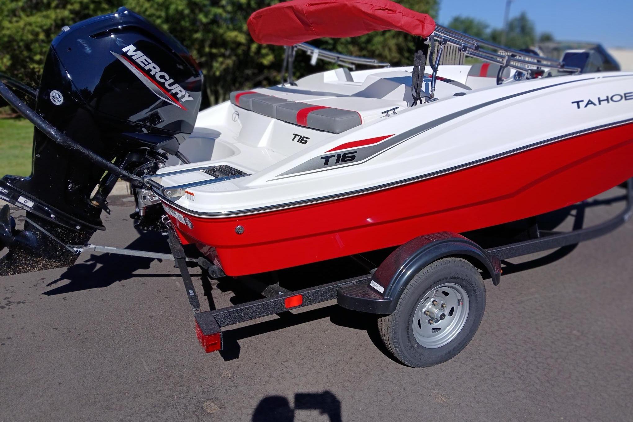 2026 Tahoe T16 boat with Mercury engine on a trailer, red and white design.