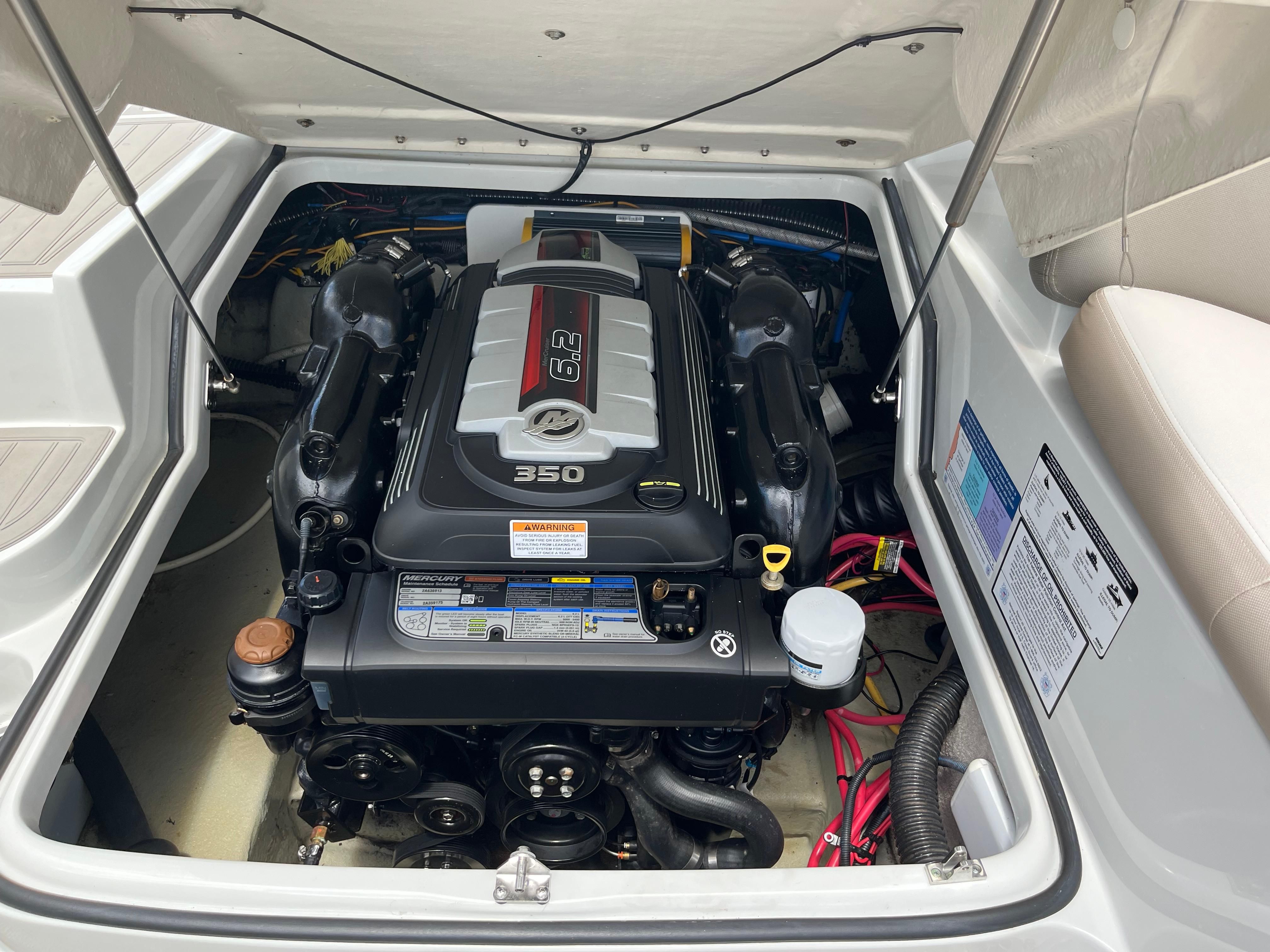 The engine compartment of a 2019 Crownline E 285 featuring a 6.2-liter engine.