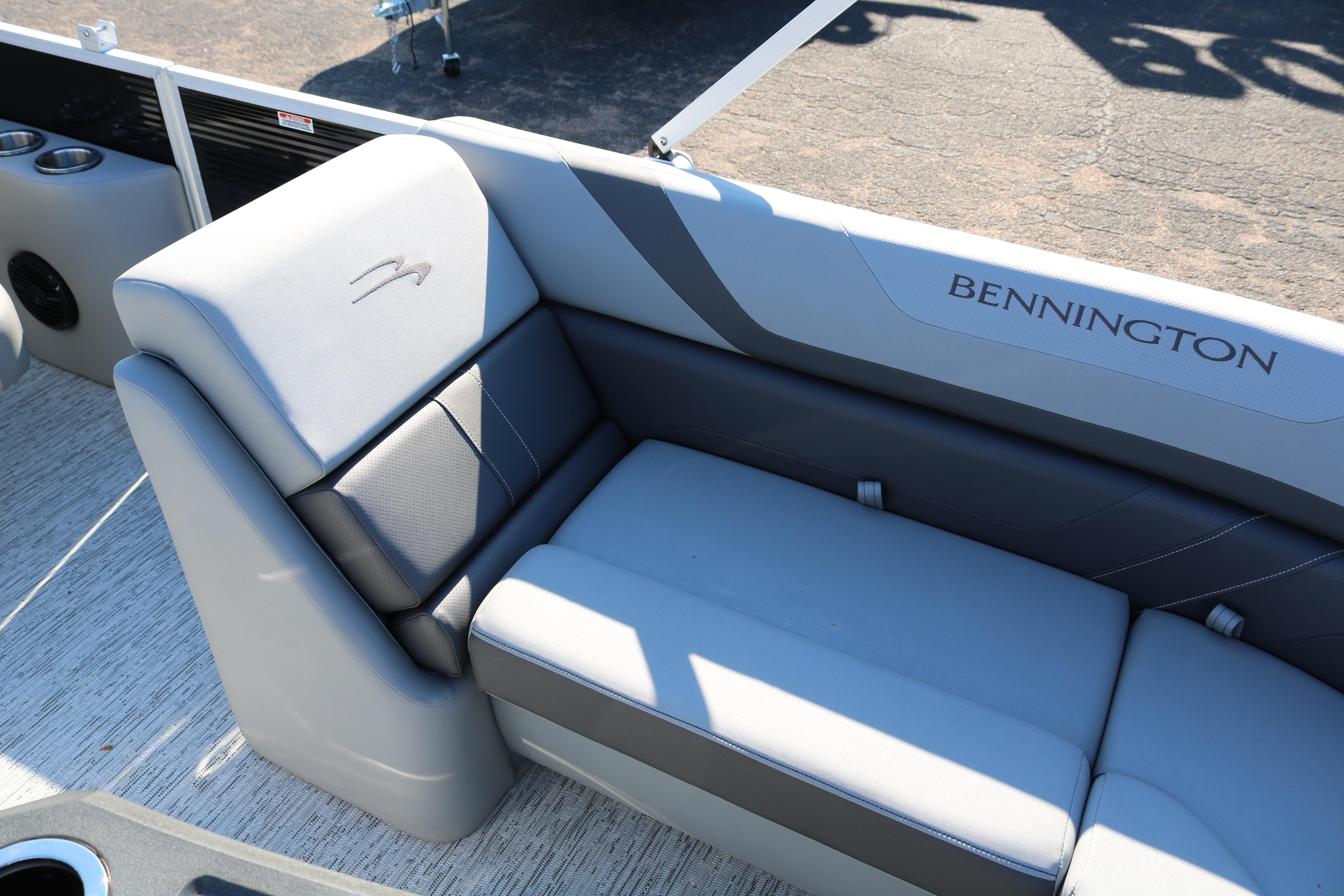 2026 Bennington 22SX Stern Radius boat interior with gray seating and logo.