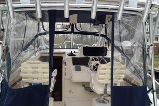 2002 Grady-White Marlin 300 boat cockpit with steering wheel and seating.