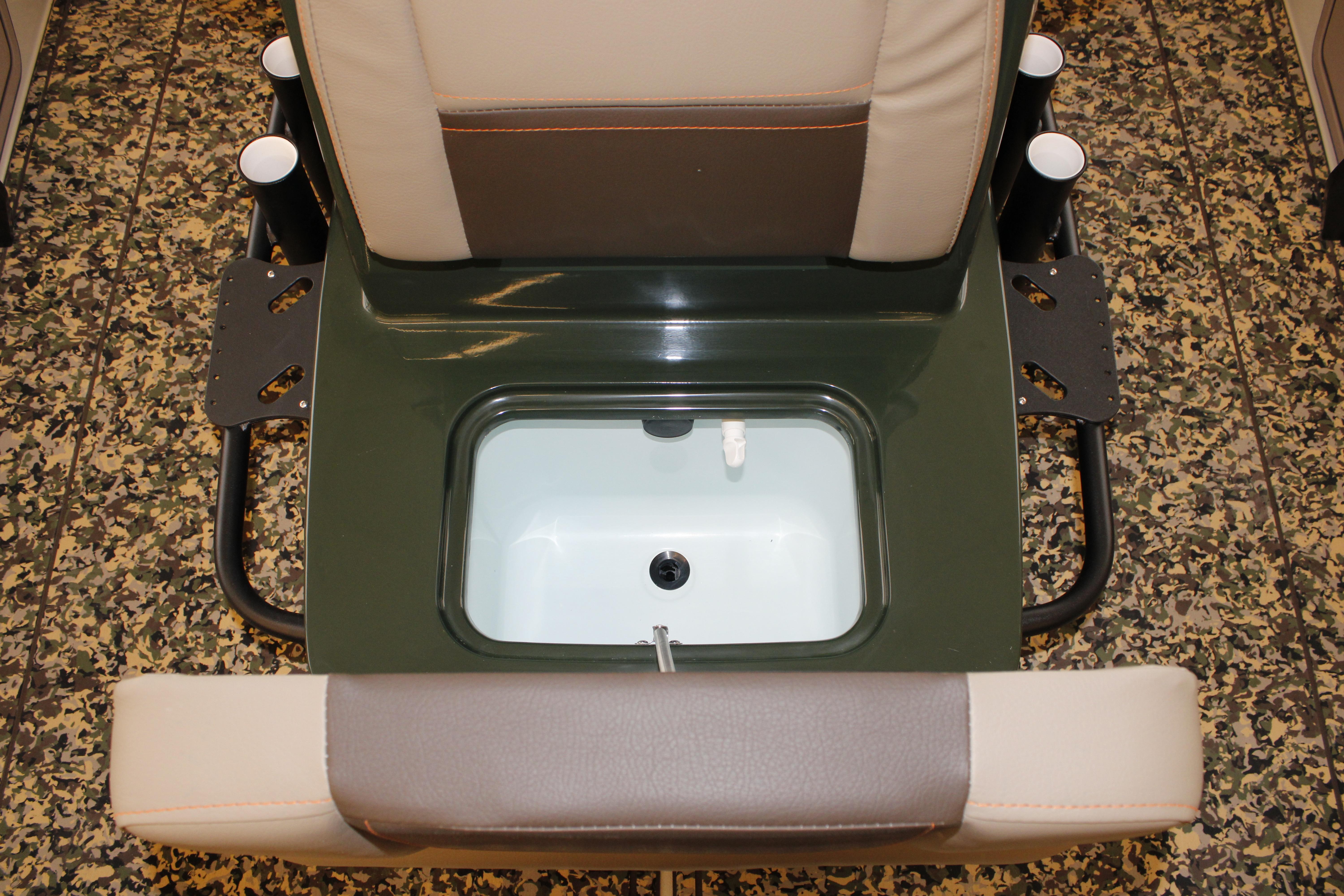 2026 Mako 18 Pro Skiff Backwater Edition boat seat with integrated storage compartment.