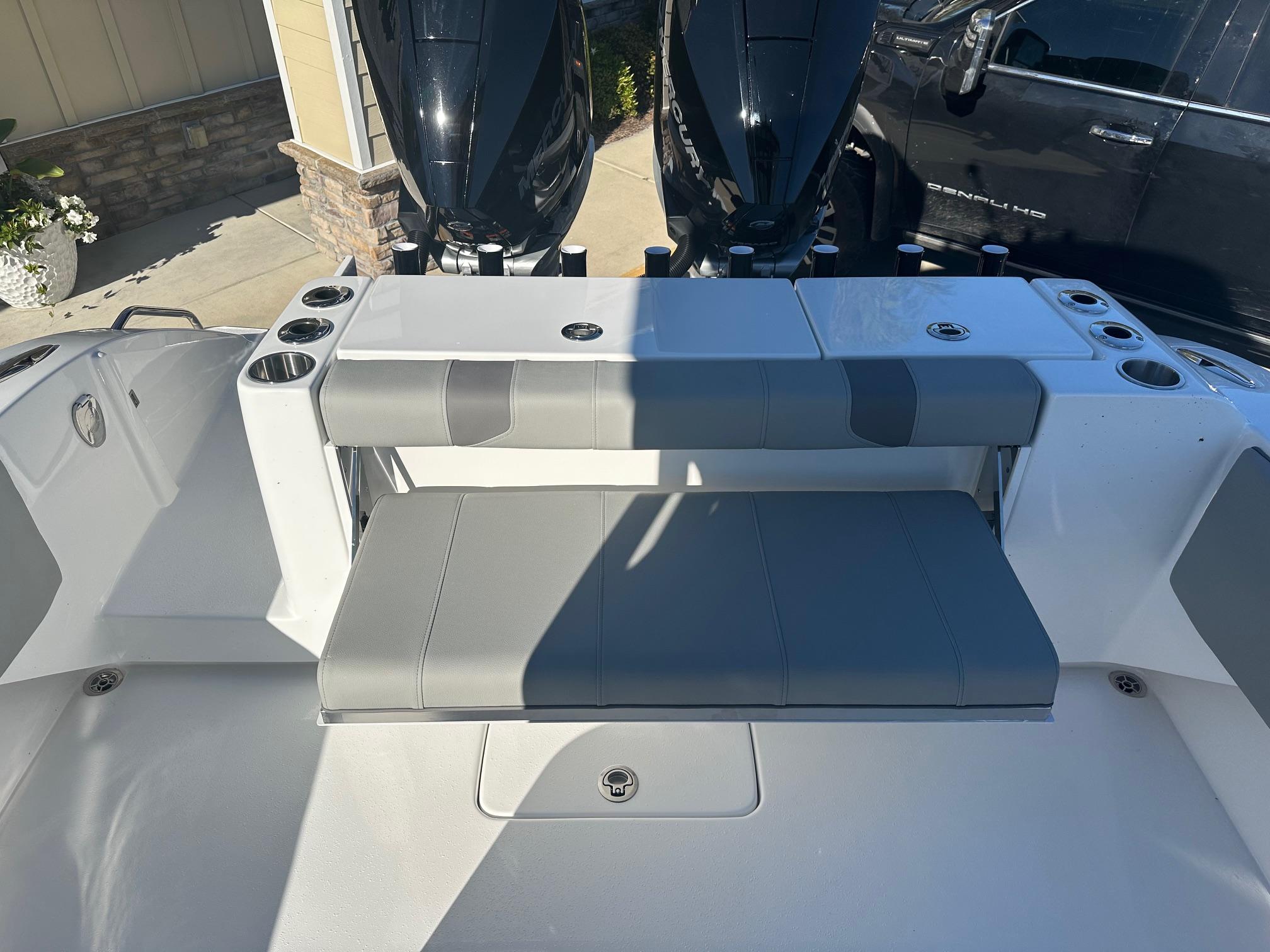 2025 Cape Horn 28XS boat interior with seating and dual outboard motors.