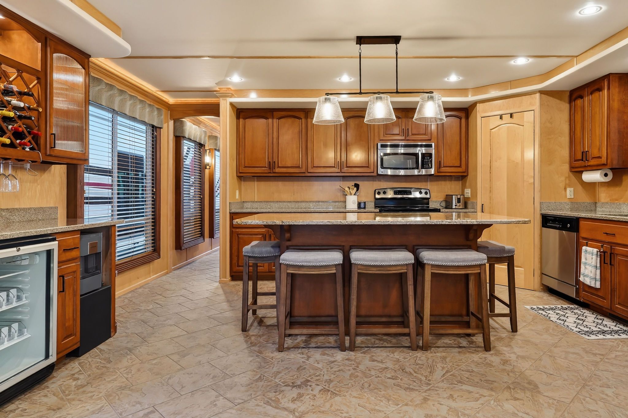 Modern kitchen in a 2010 houseboat with wooden cabinets and island.