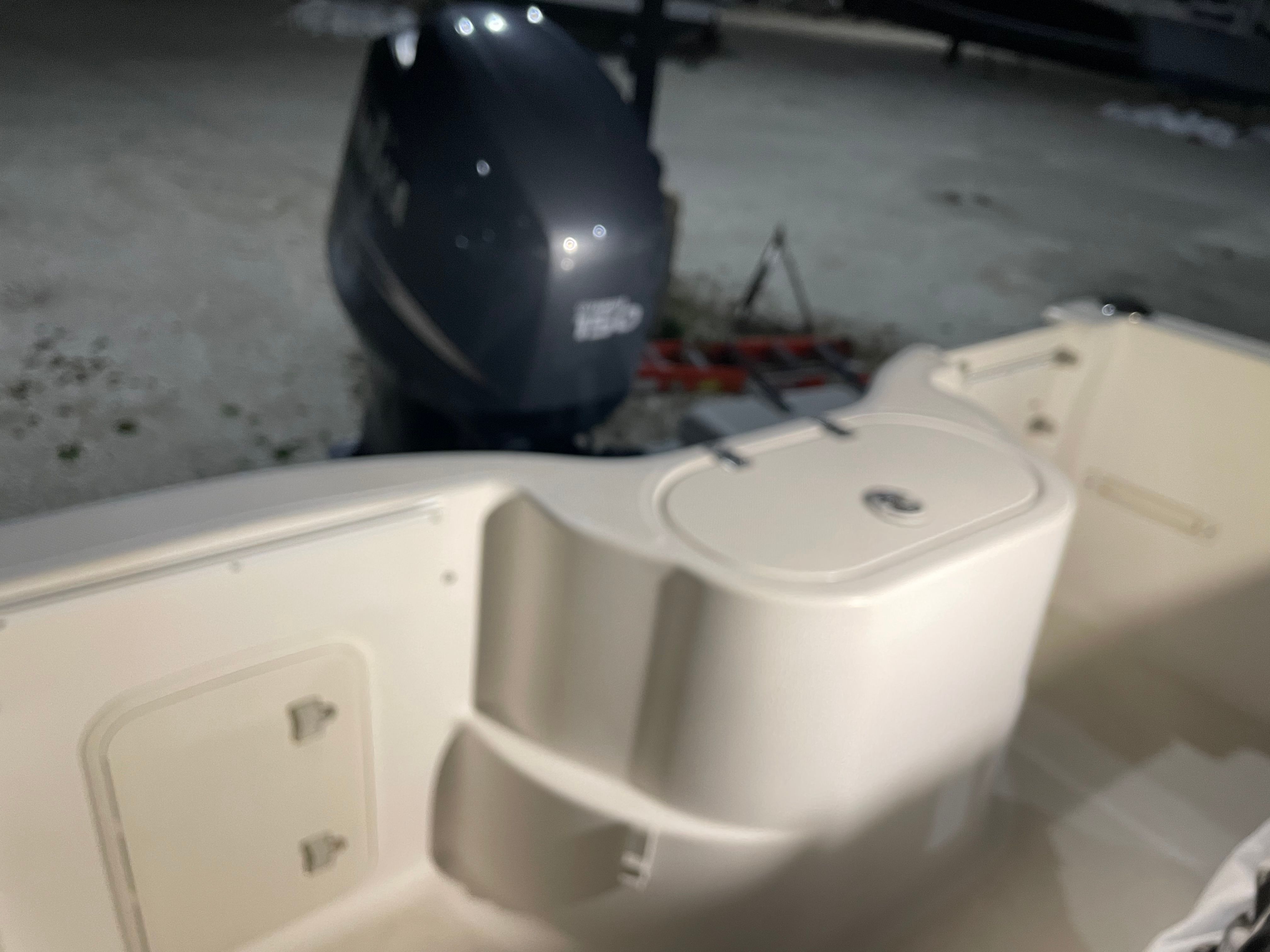 2005 Aquasport 210 Osprey with outboard motor, close-up view.